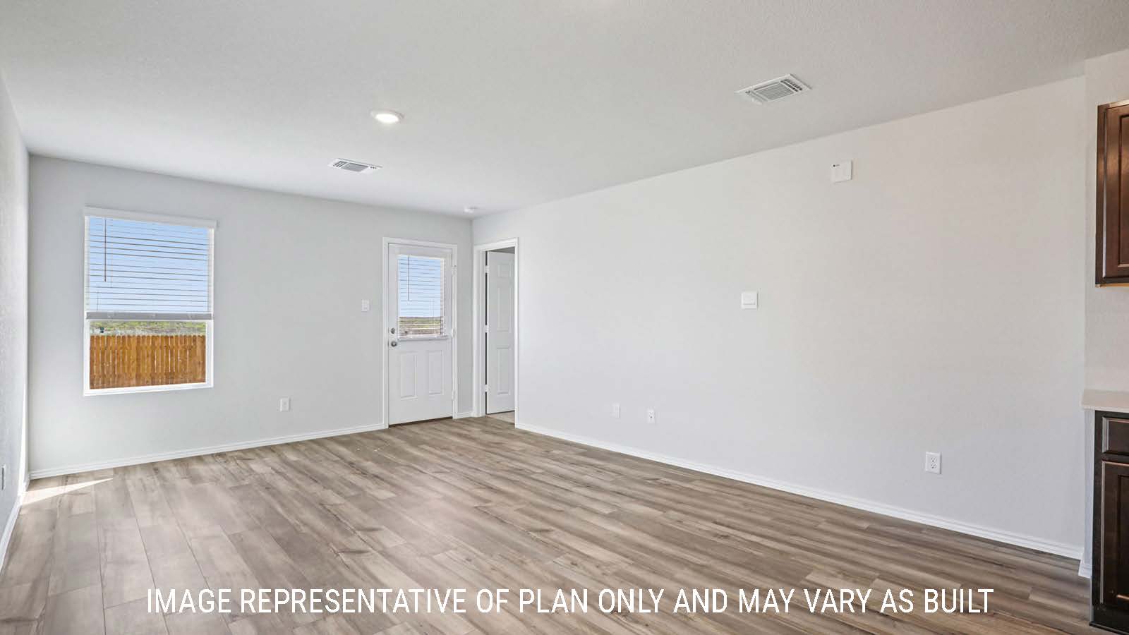 Atlanta dining room with vinyl plank flooring and view of open concept living room.