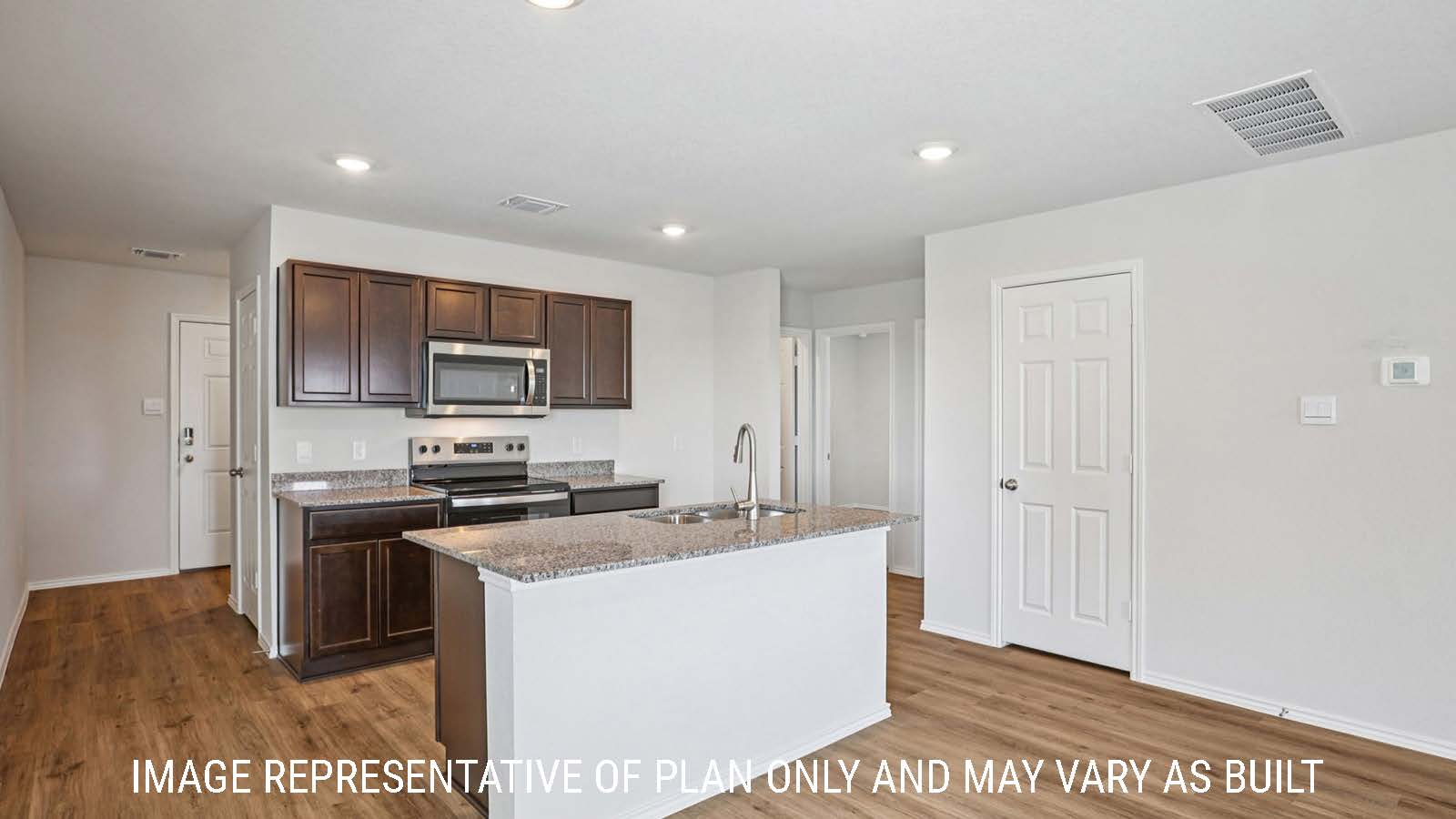 Barton kitchen with kitchen island with granite countertops and view of entry way.
