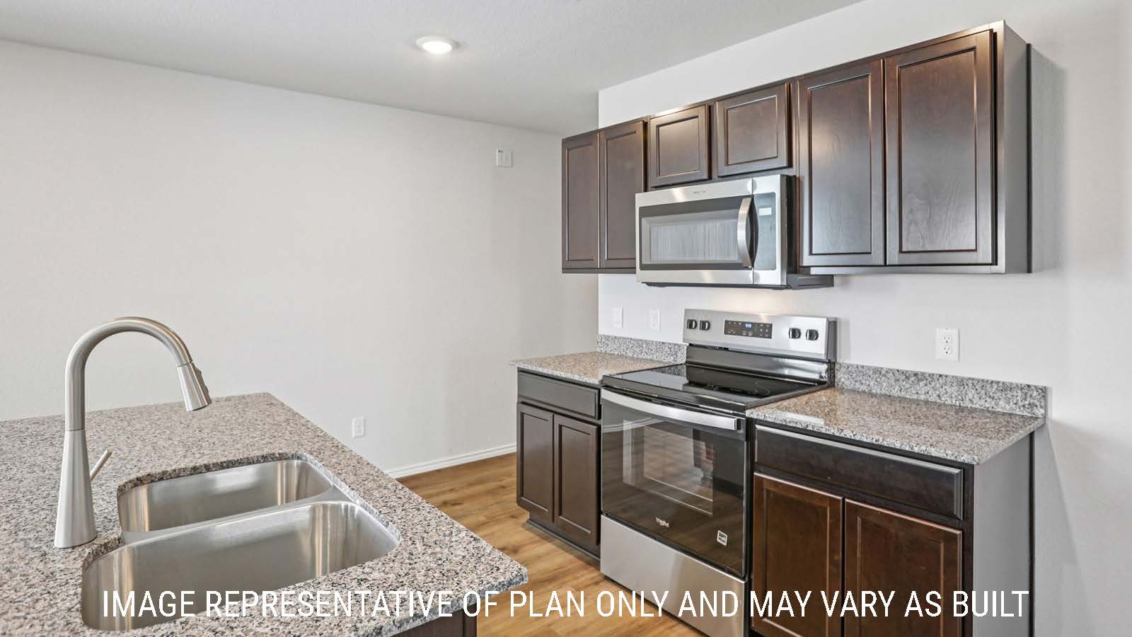 Barton kitchen with center kitchen island with granite countertops and dark cabinets.