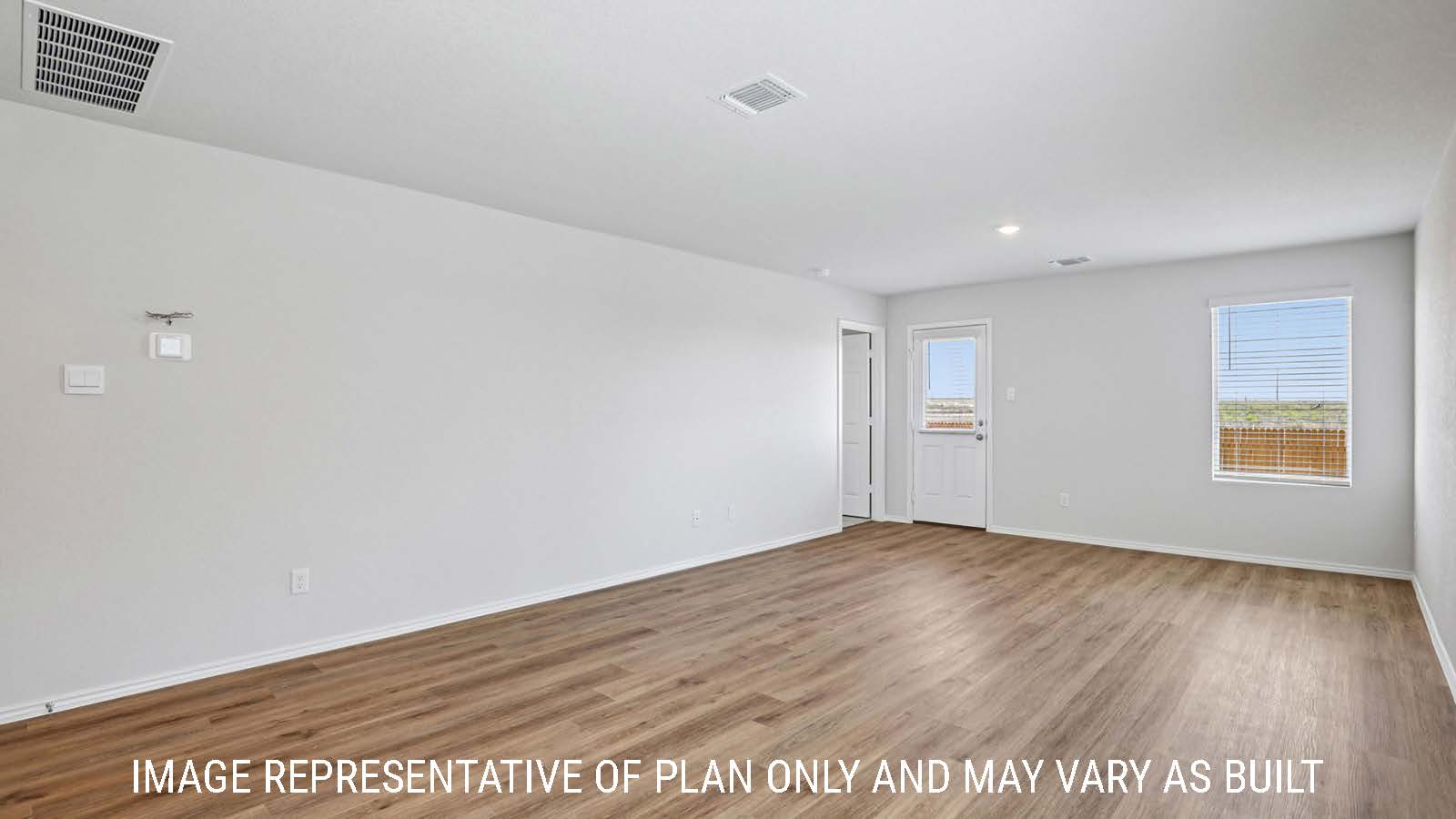 Barton living room with vinyl plank flooring with view of backyard and window for lighting.