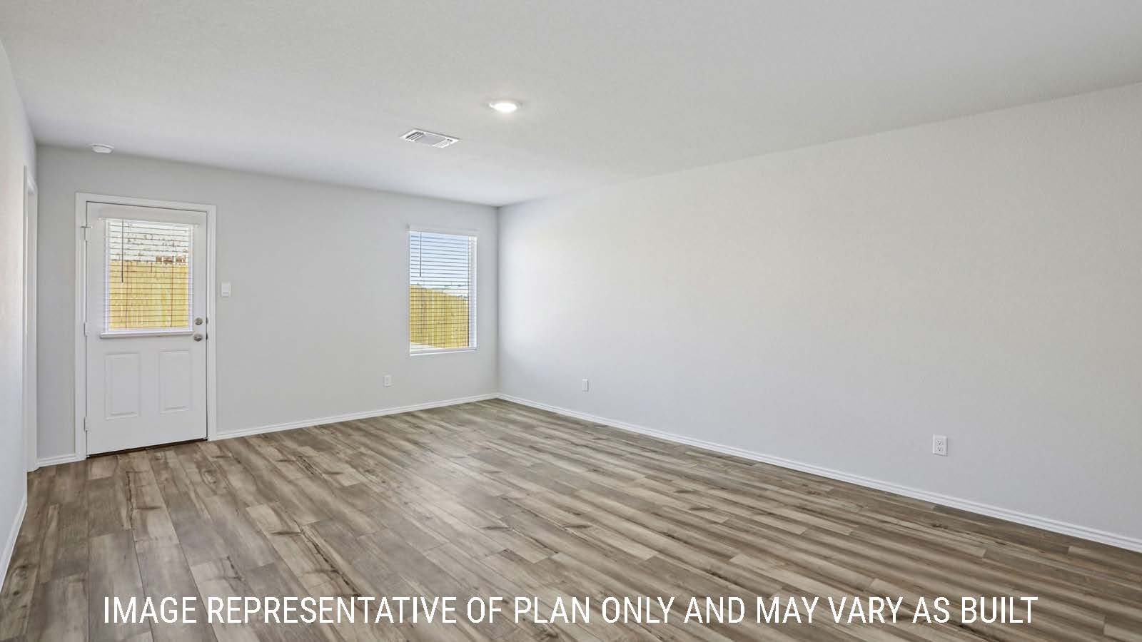 Caprock living room with view of back door and windows for natural lighting.