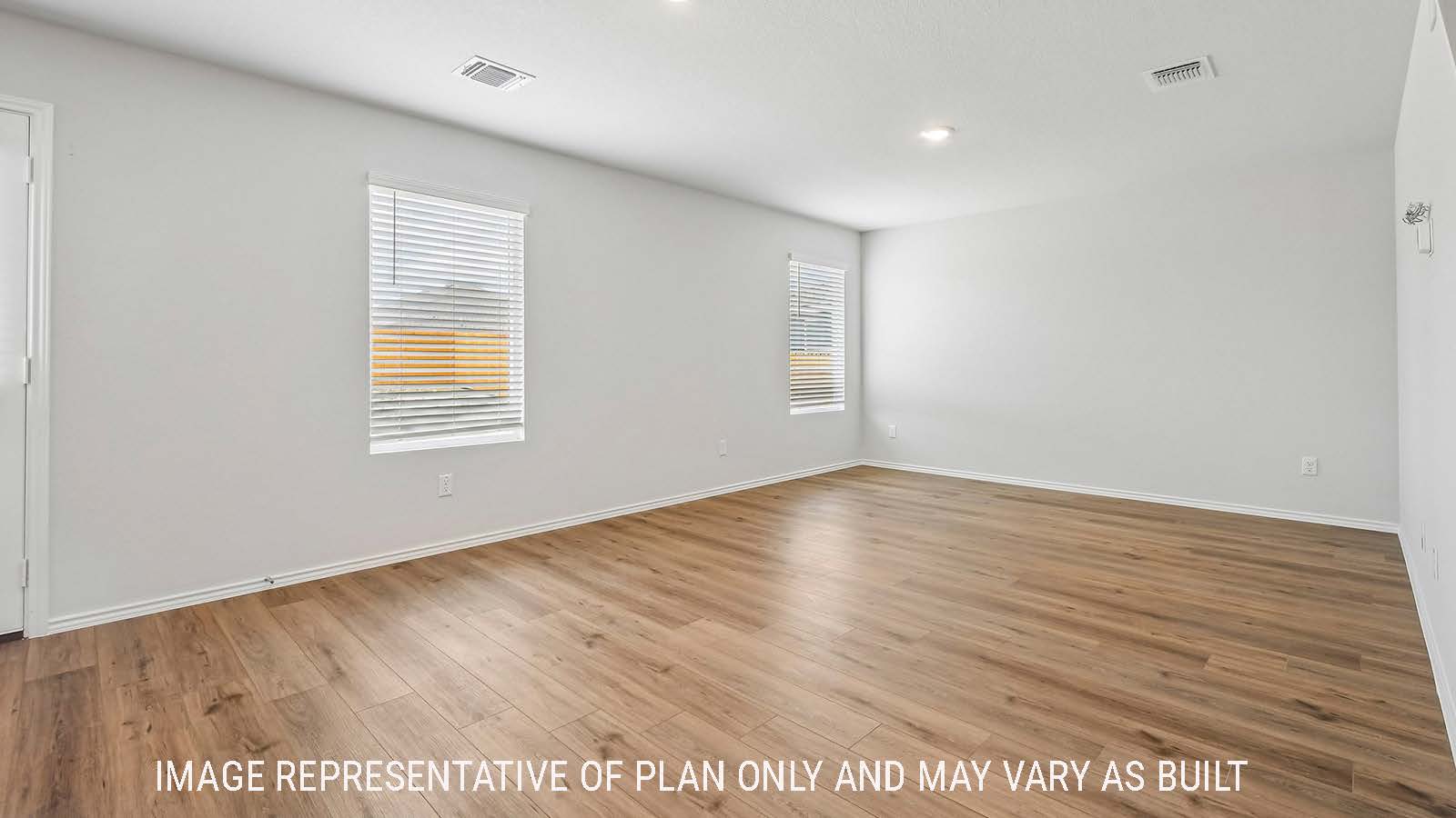 Davis living room with window for natural lighting and view of backyard.