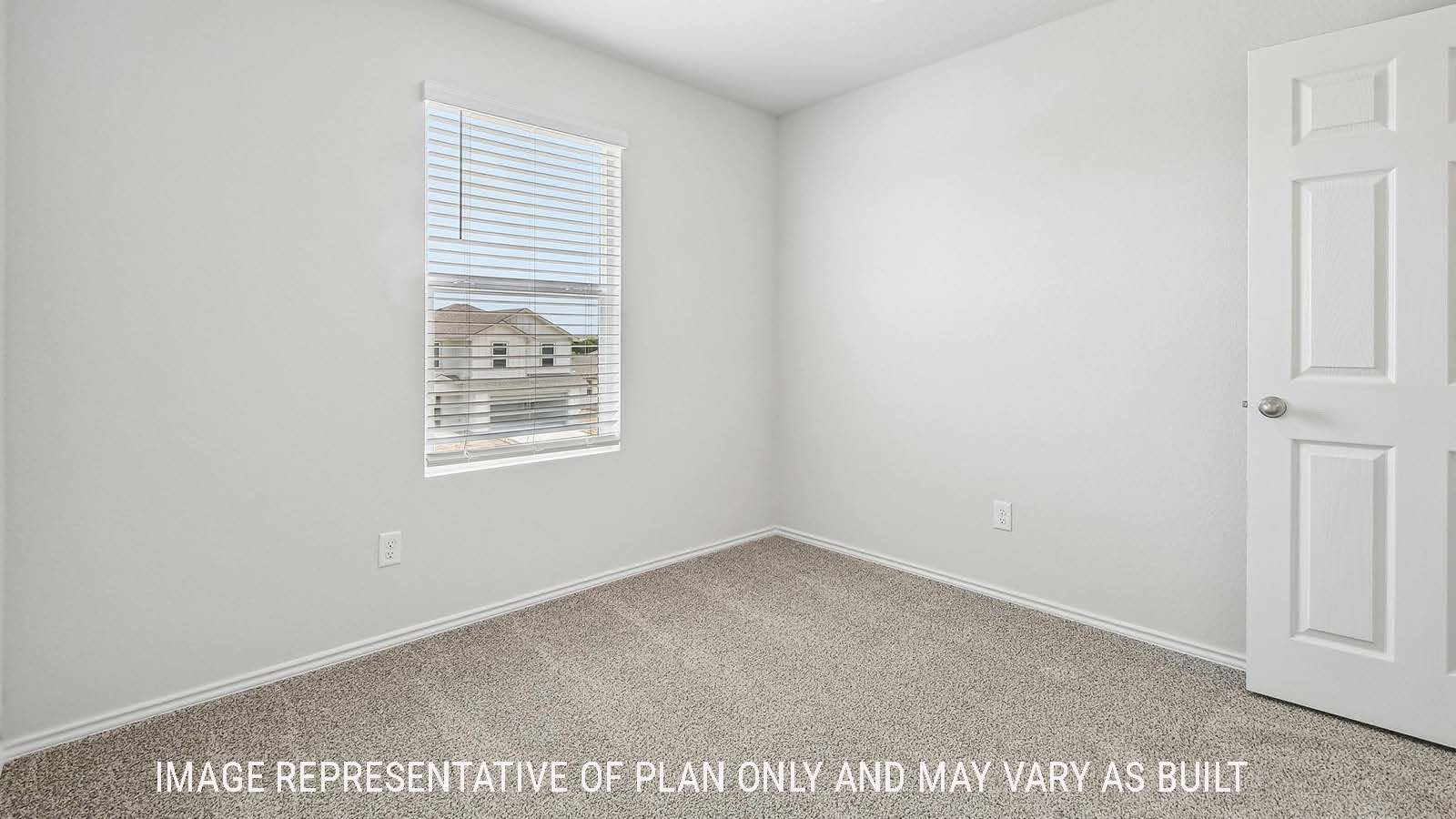 Davis secondary bedroom with carpeted flooring and window for natural lighting.