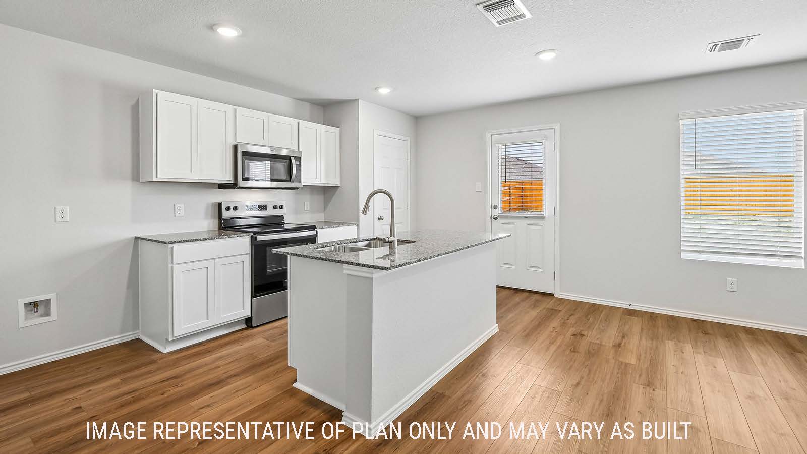 Davis kitchen with kitchen island with white cabinets and granite countertops.