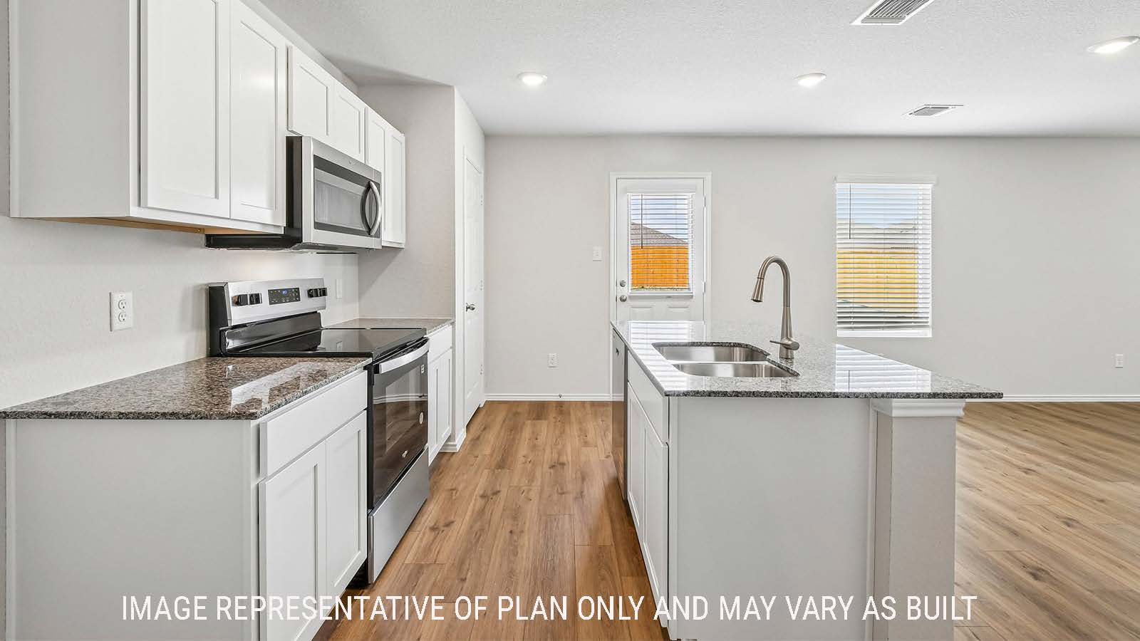 Davis kitchen with kitchen island with white cabinets and granite countertops.