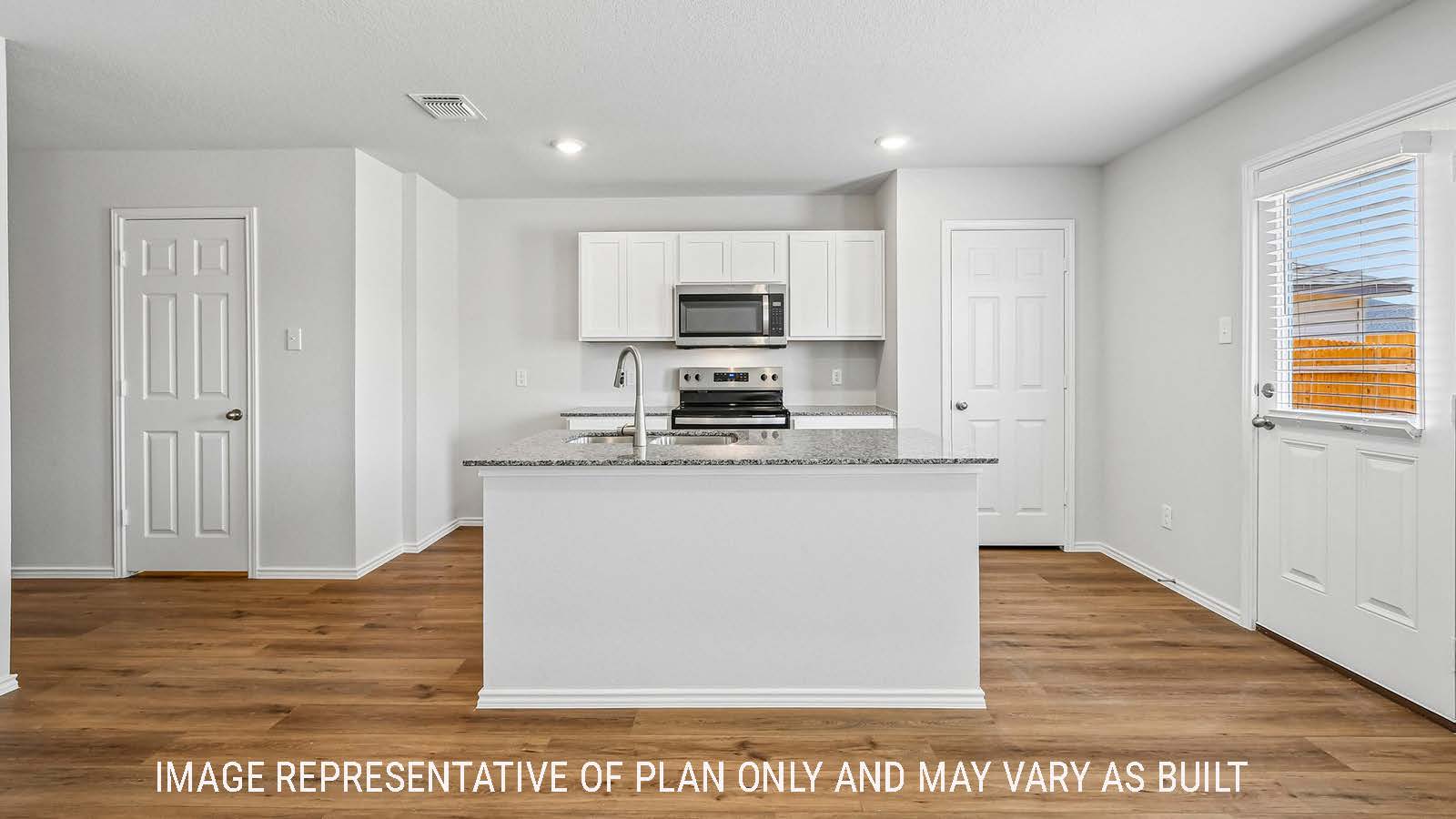 Davis kitchen with kitchen island with white cabinets and granite countertops.