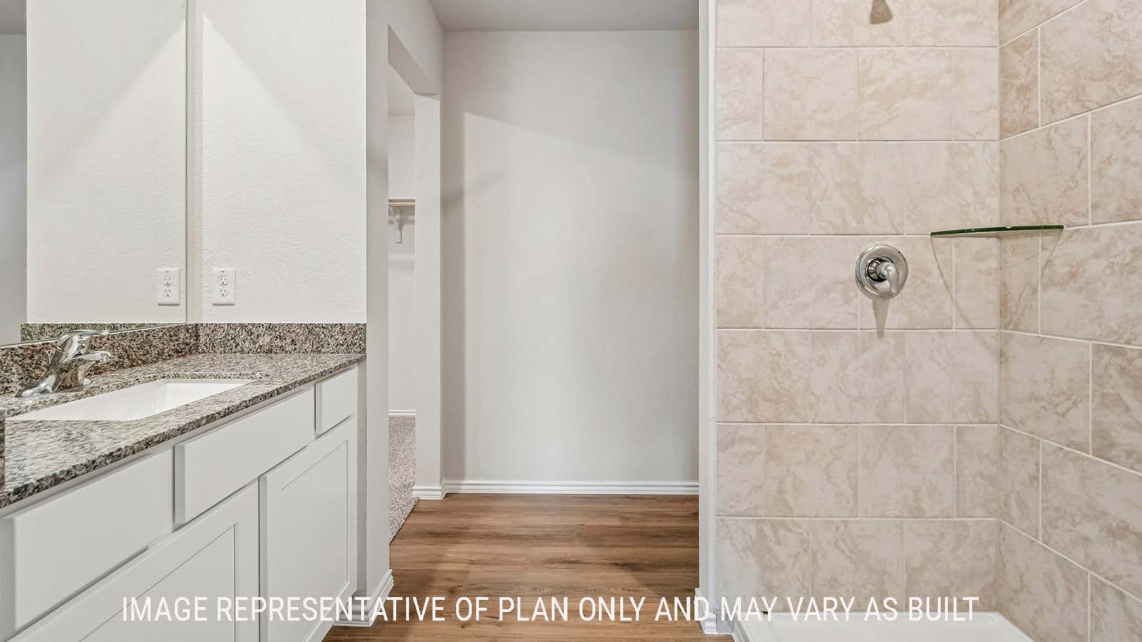 Davis primary bathroom with view of vanity and walk-in shower.