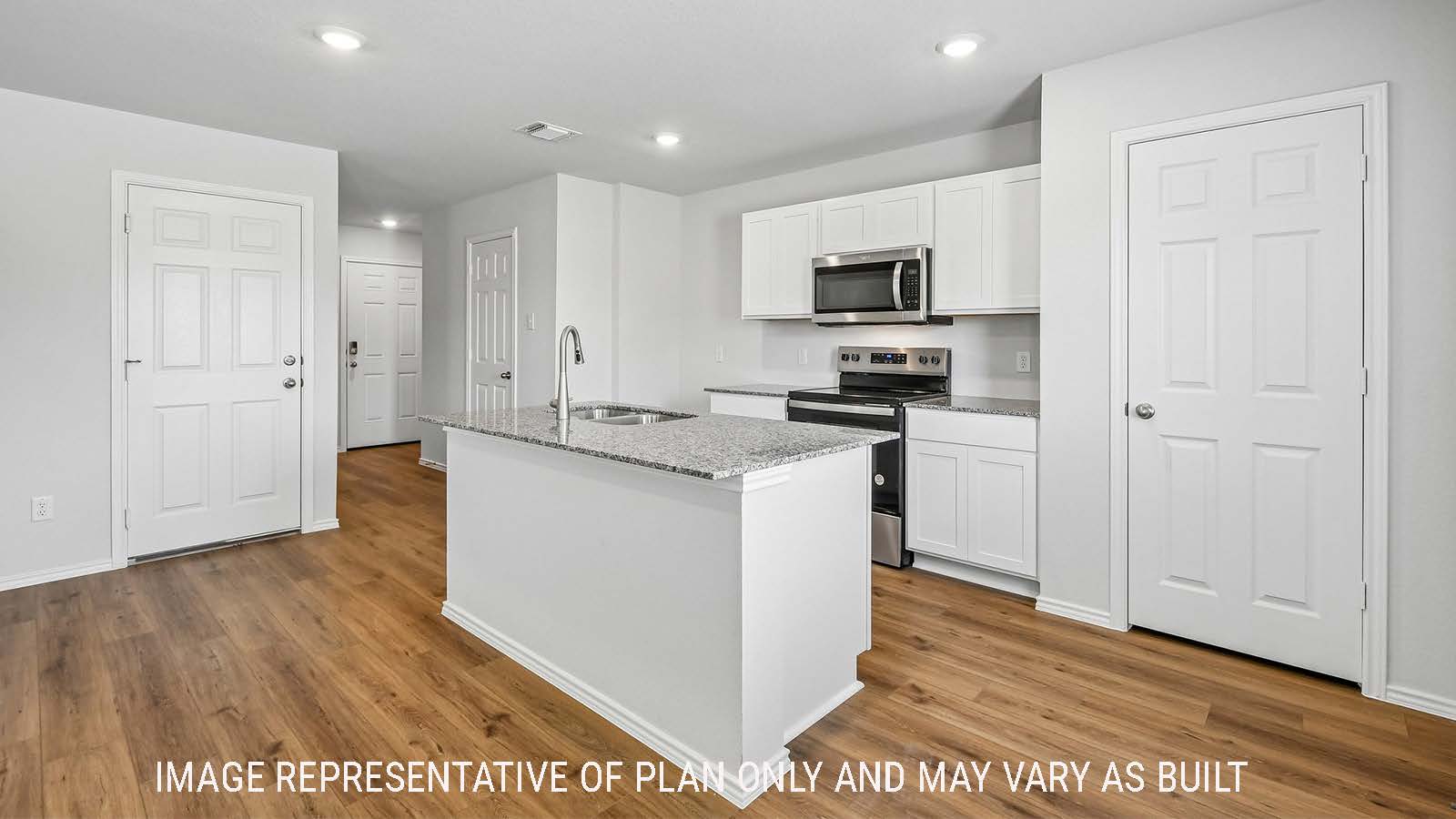 Davis kitchen with kitchen island and view of front entry way.