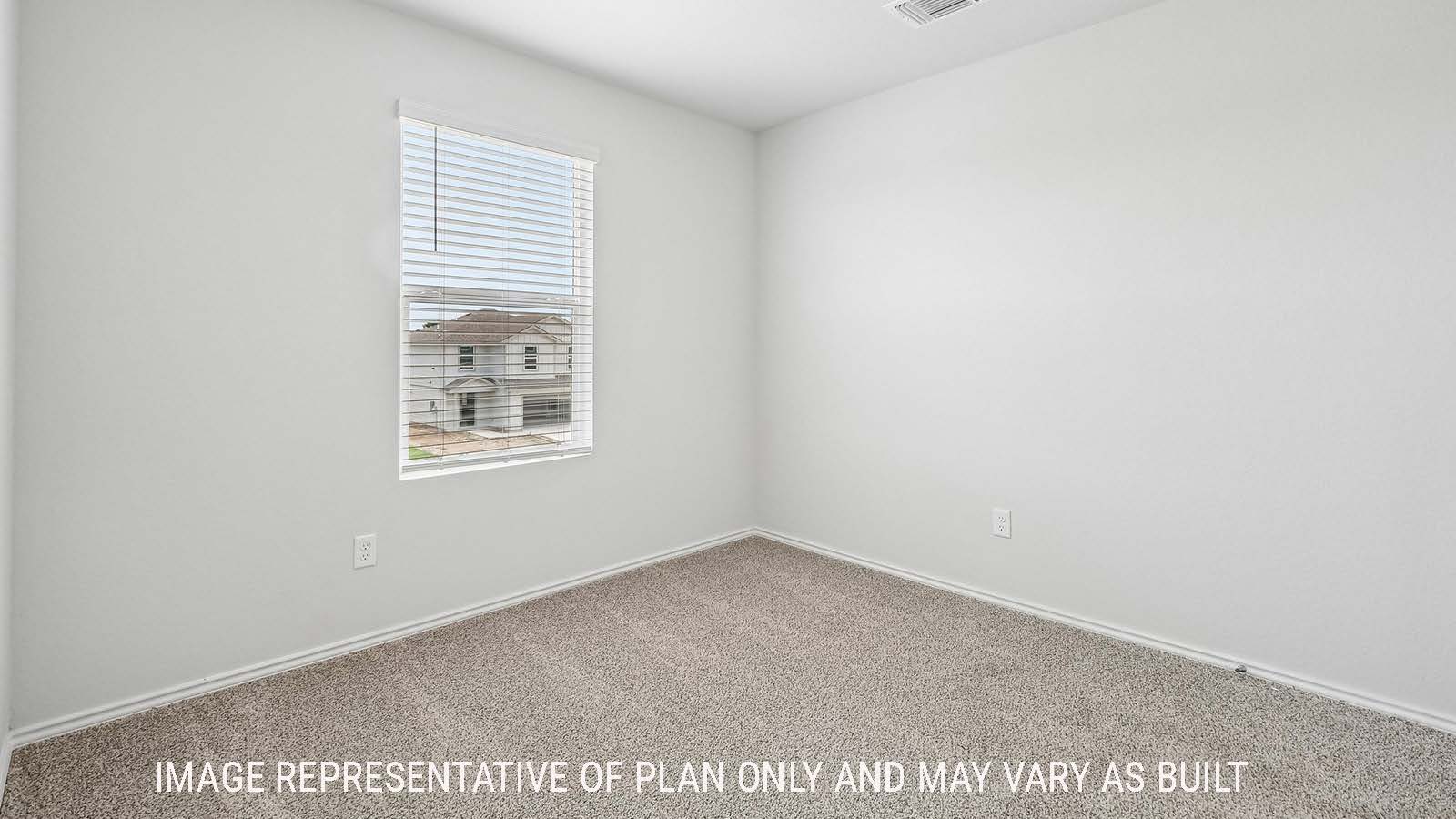 Davis secondary bedroom with carpeted flooring and window for natural lighting.