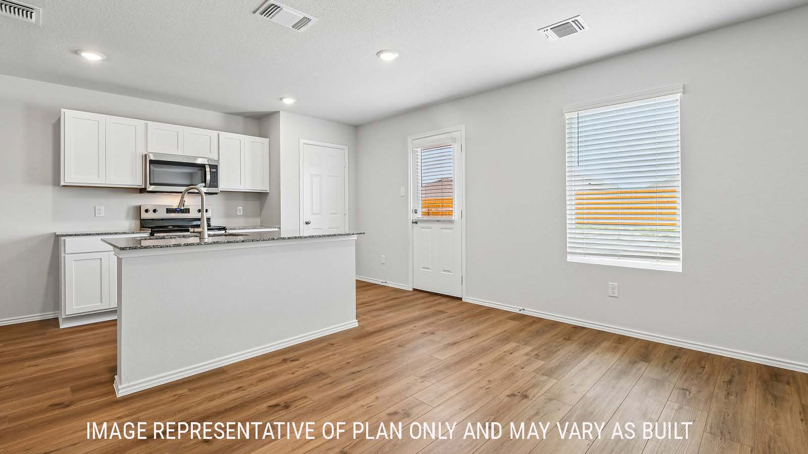 Davis kitchen with kitchen island with white cabinets and granite countertops.