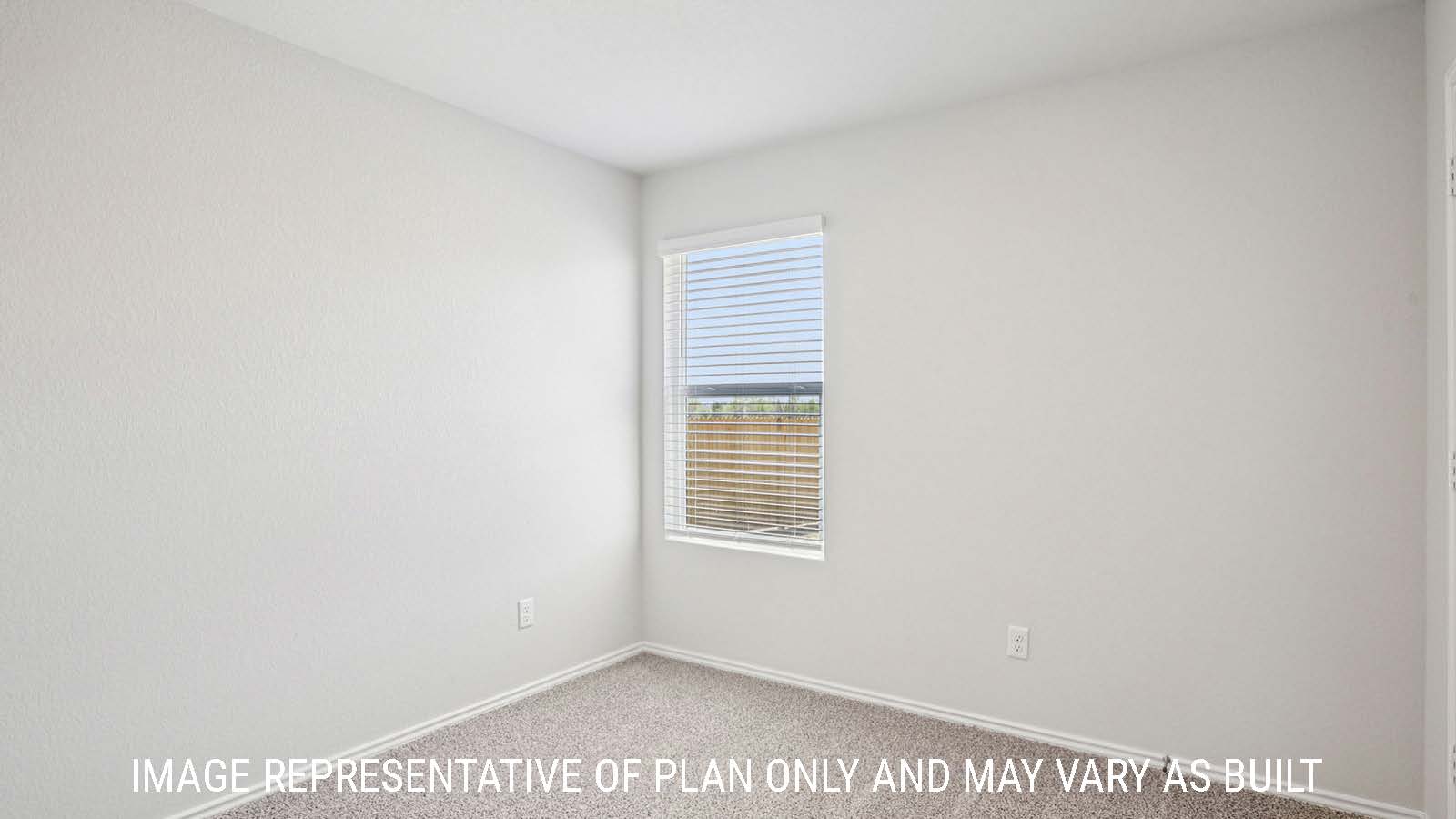 Estero secondary bedroom with carpeted flooring and window for natural lighting.