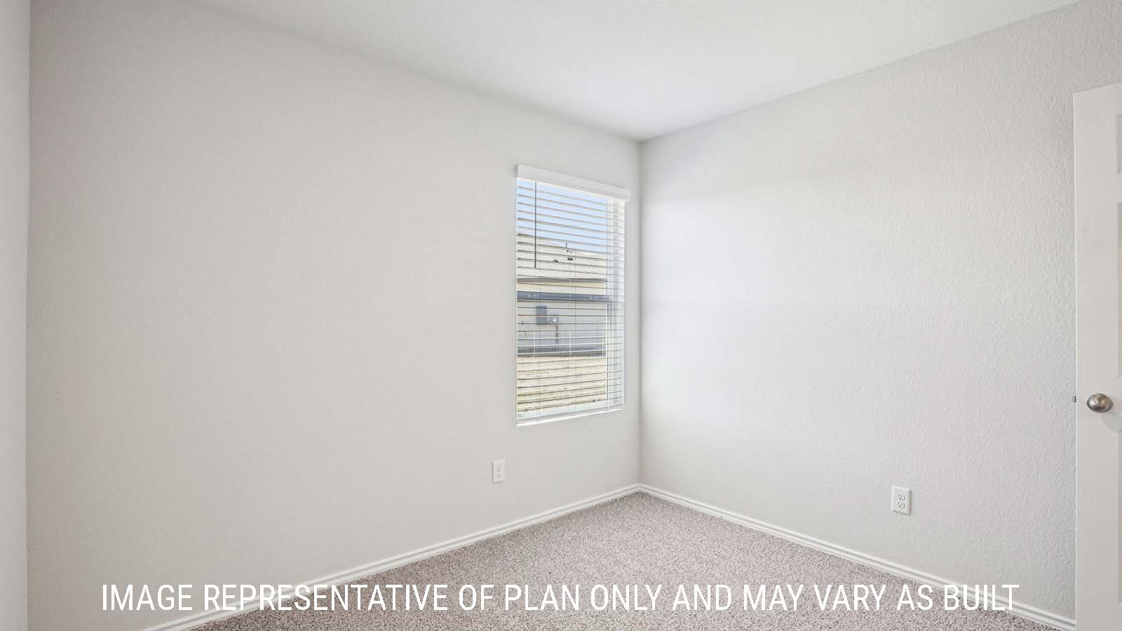 Estero secondary bedroom with carpeted flooring and window for natural lighting.