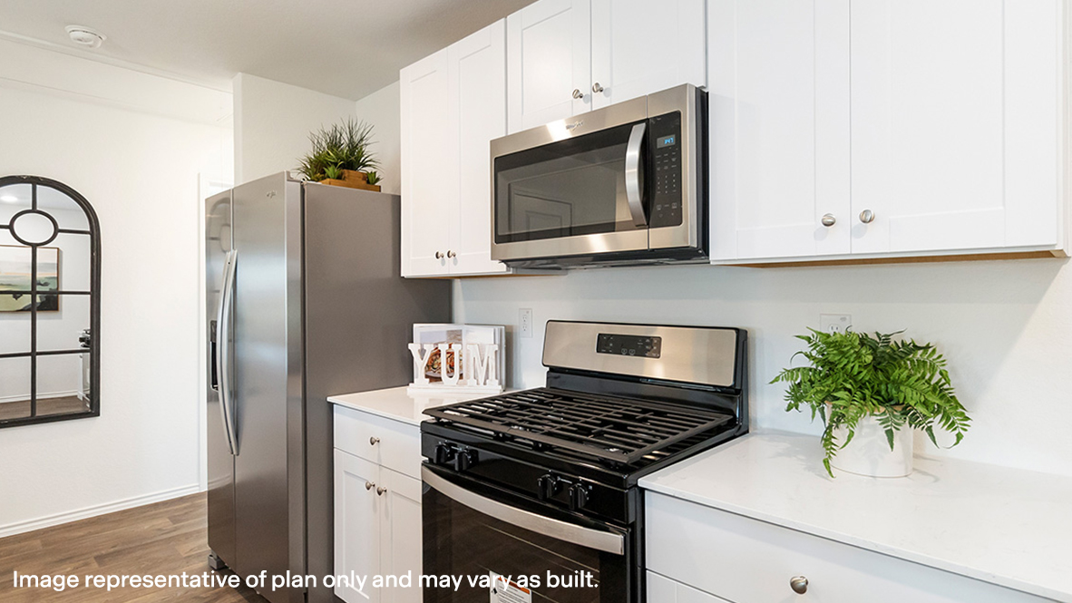 Estero kitchen white cabinets and granite countertops.