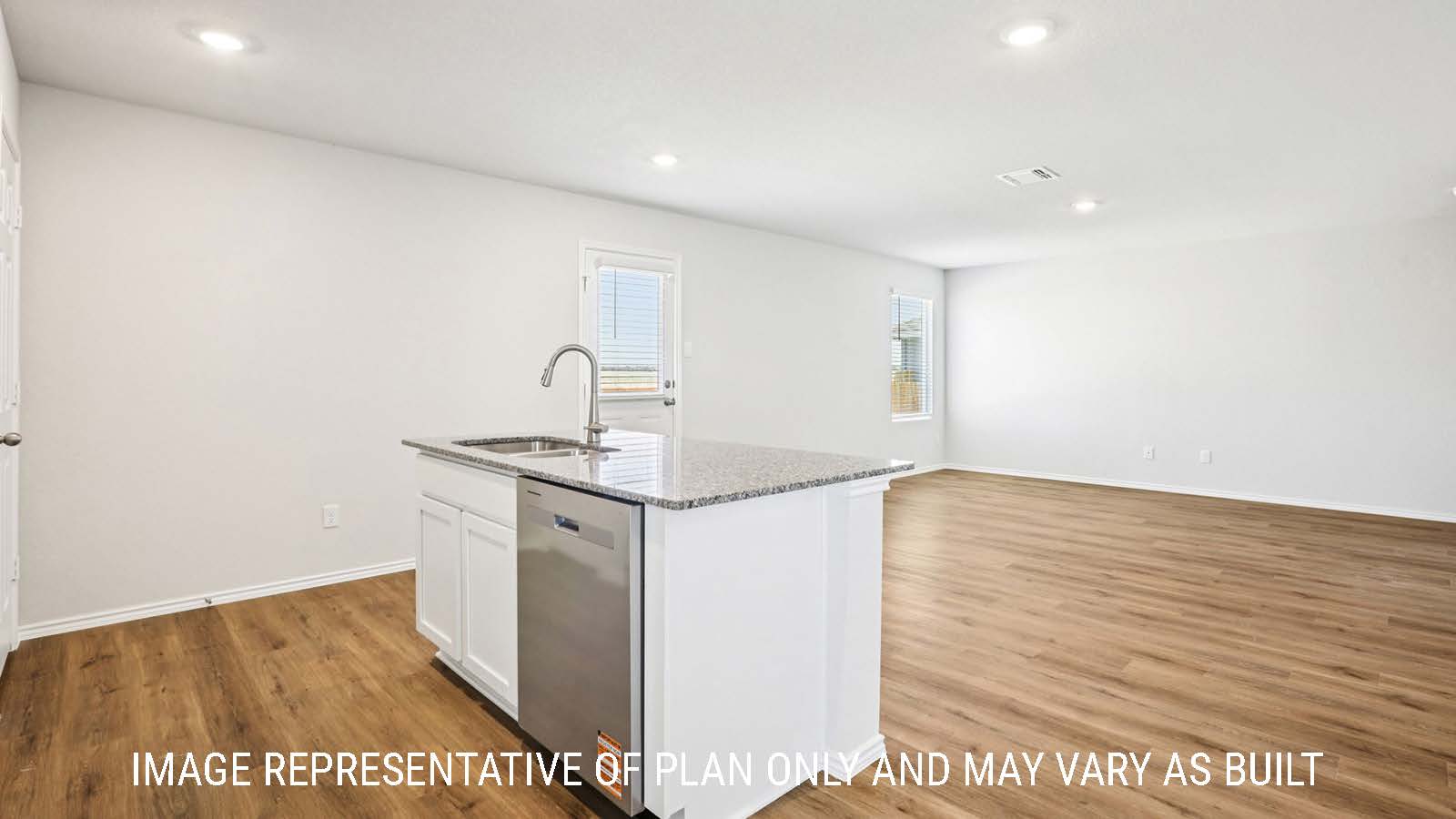 Franklin kitchen with kitchen island with granite countertops with view of open concept living room.