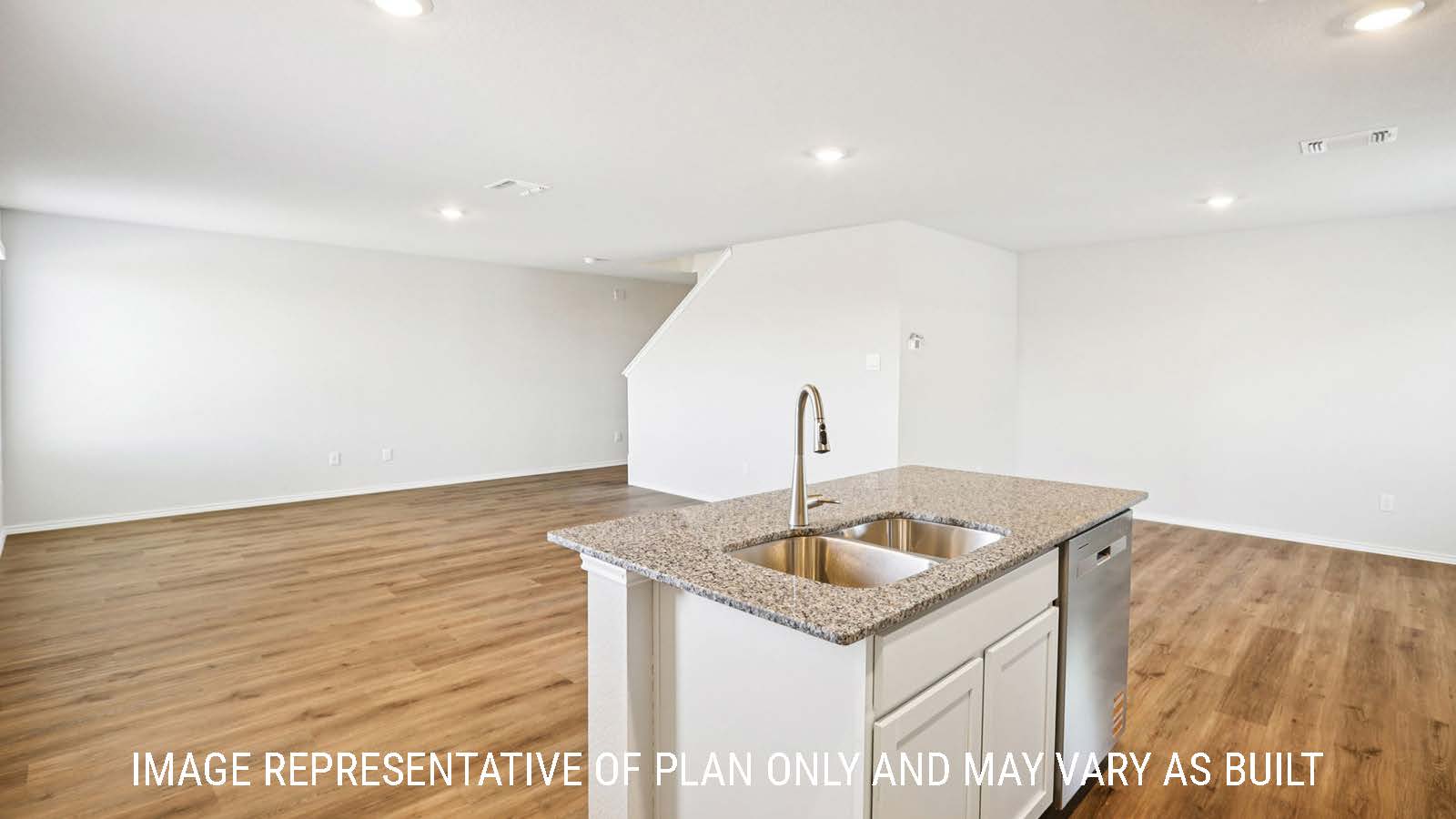 Franklin kitchen with kitchen island with granite countertops with view of open concept dining room and living room.