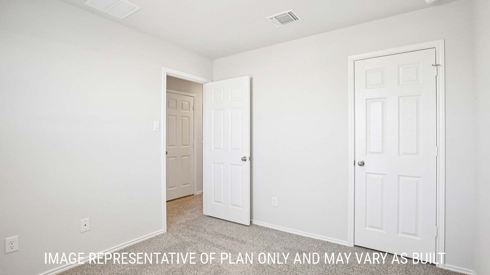 Franklin secondary bedroom with carpeted flooring and view of hallway.