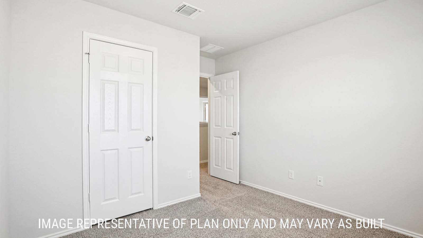 Franklin secondary bedroom with carpeted flooring and view of hallway.