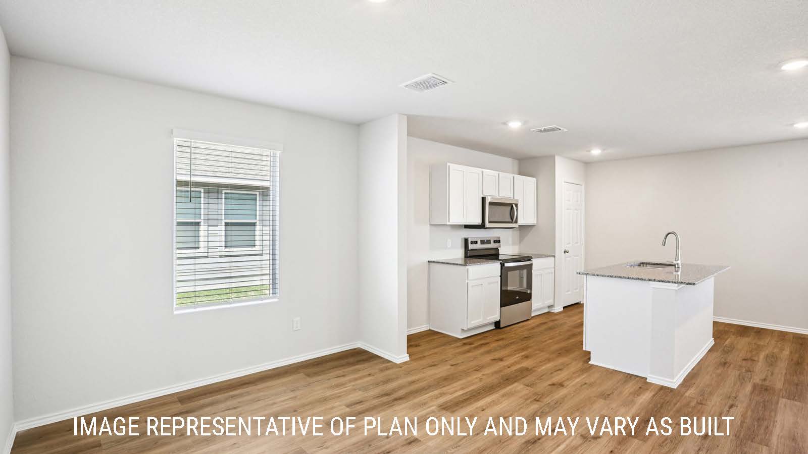 Franklin kitchen with kitchen island with granite countertops with view of open concept dining room and living room.