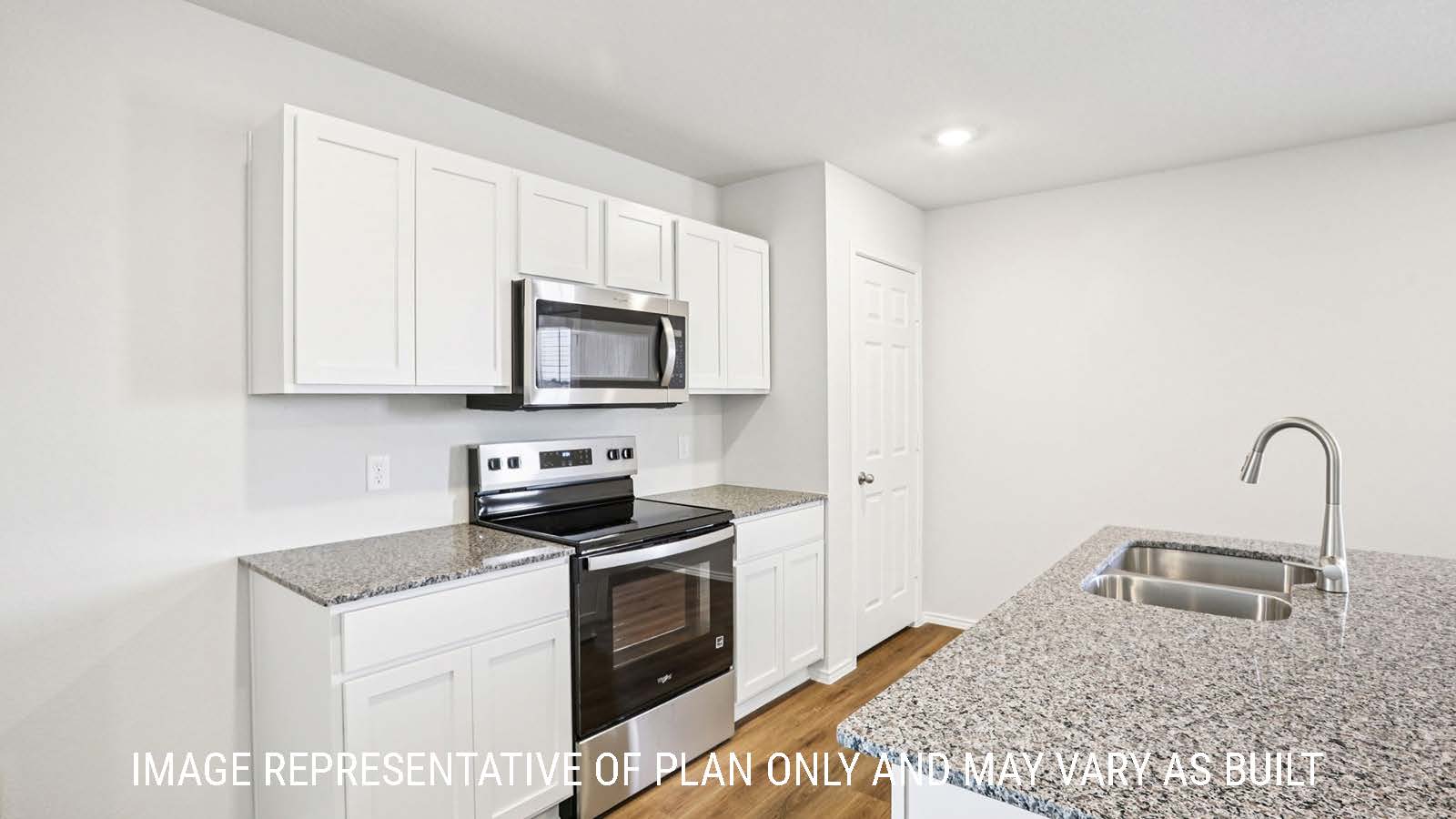 Franklin kitchen with kitchen island with granite countertops and light cabinets.