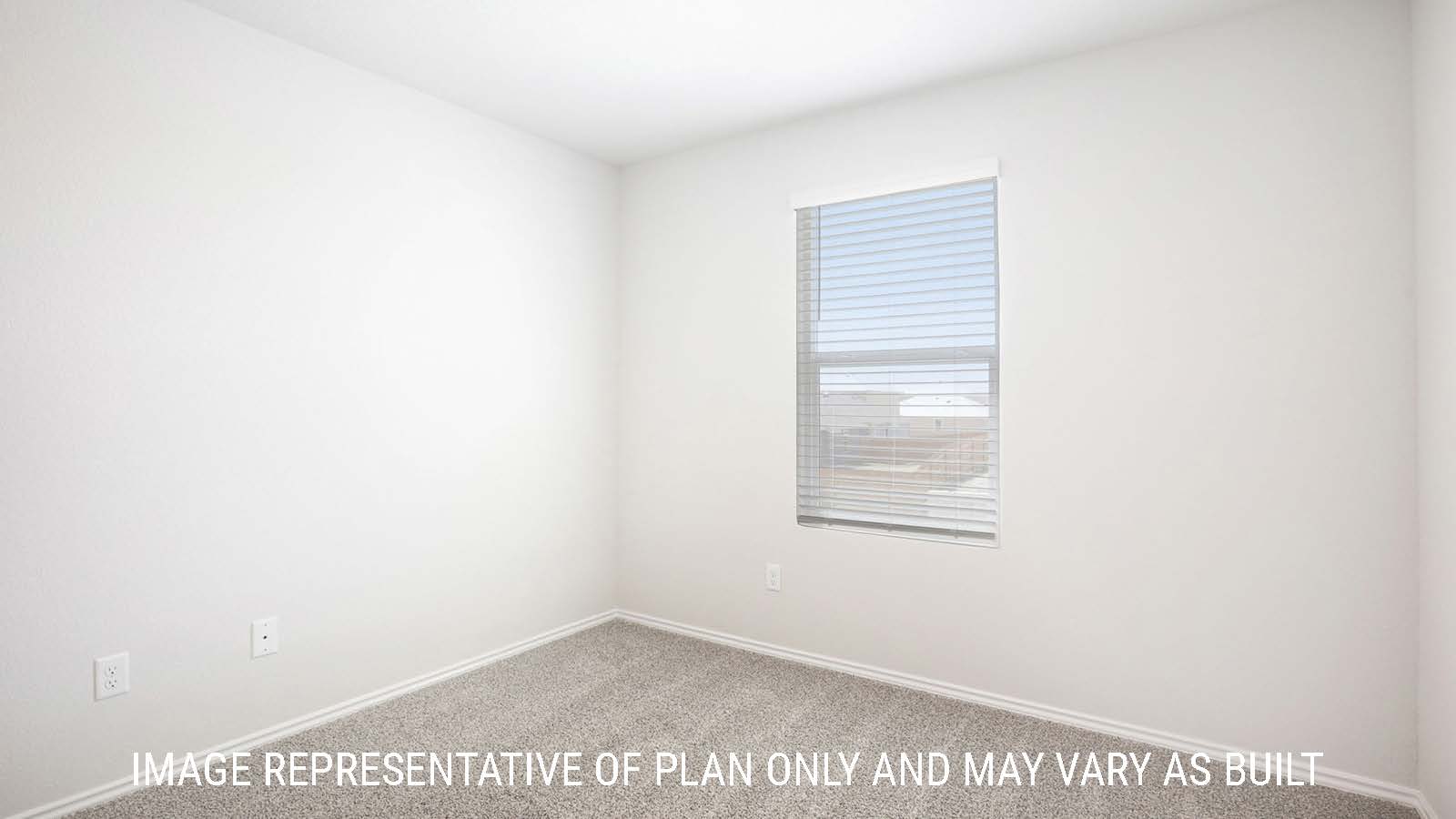 Franklin secondary bedroom with carpeted flooring and window for natural lighting.