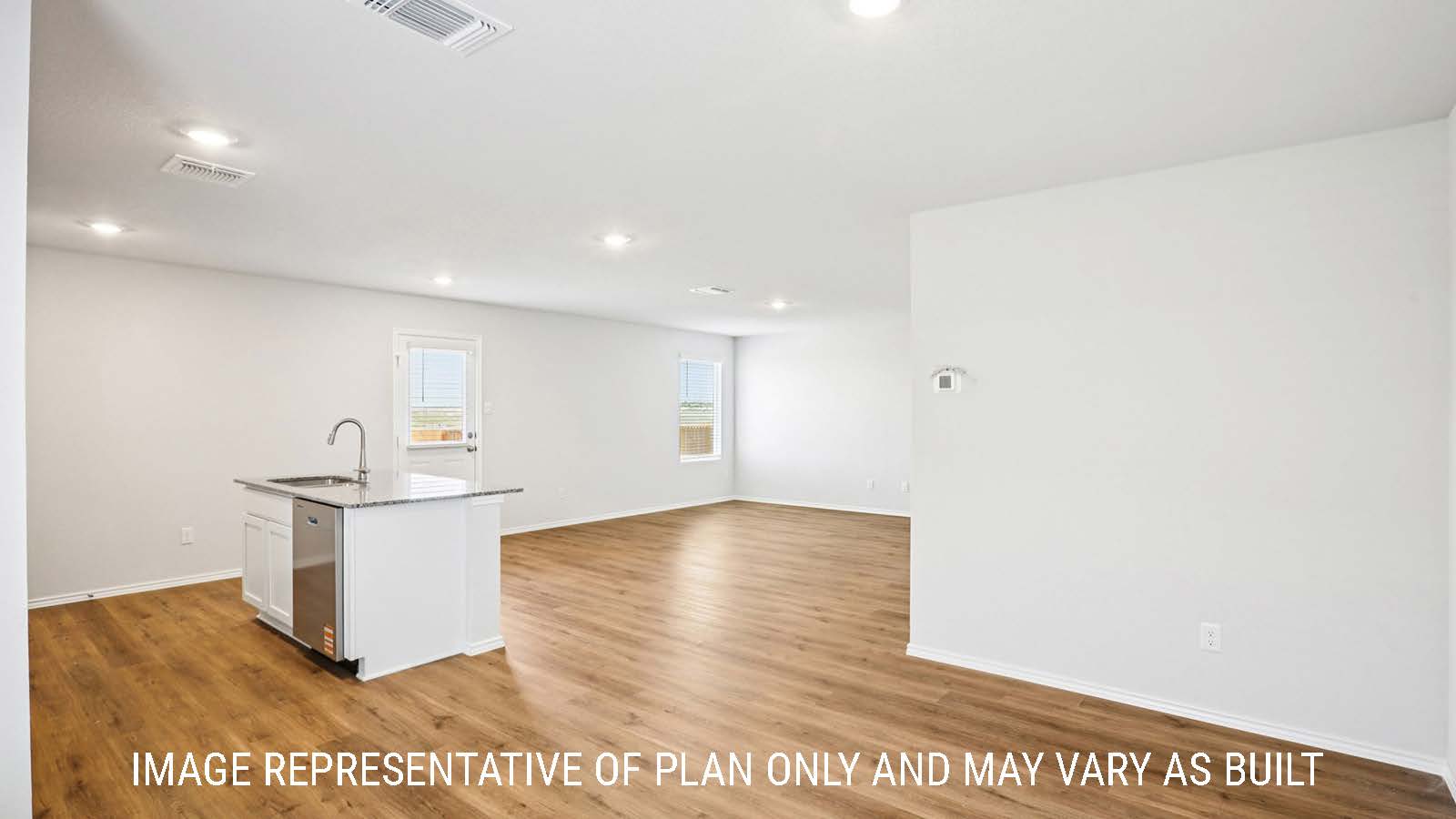 Franklin dining room with vinyl plank flooring and view of open concept kitchen and living room.