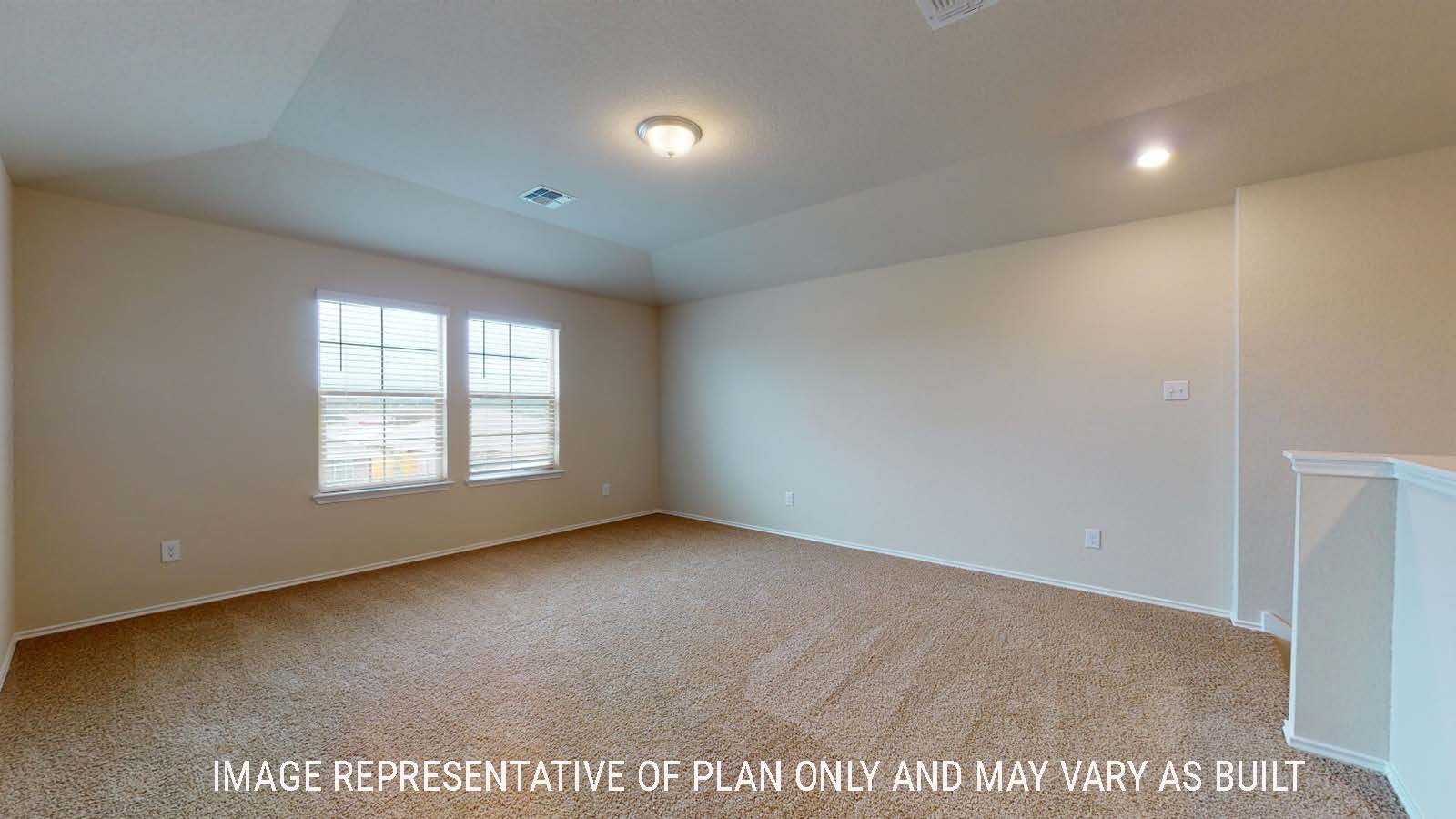 Perry game room with carpted flooring and windows for natural lighting.