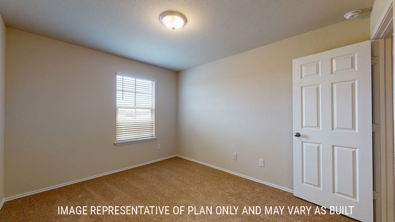Perry secondary bedroom with carpted flooring and window for natural lighting.