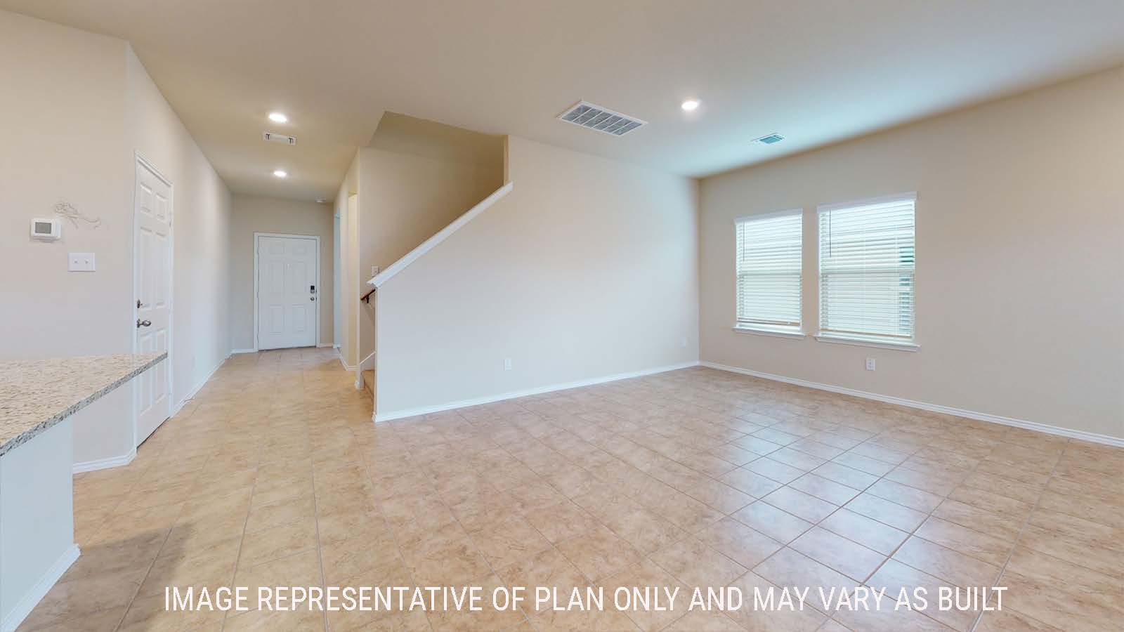 Perry dining room with windows for natural lighting and view of entry hallway and stairs.