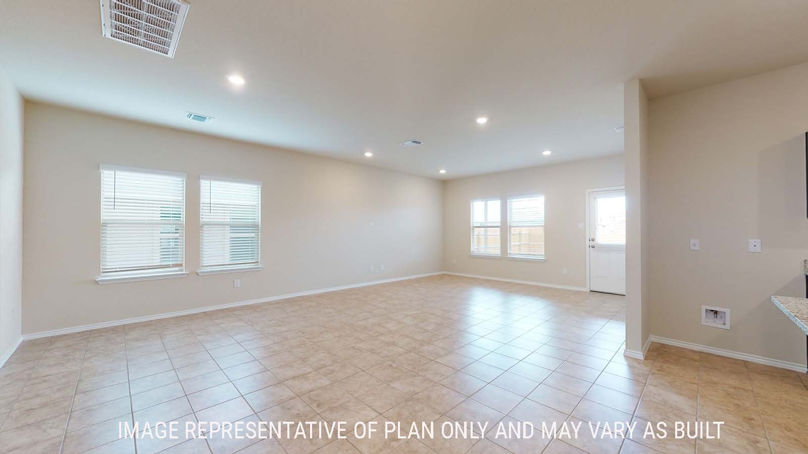 Perry living room with windows for natural lighting and view of back door to the back yard.