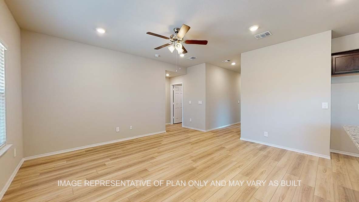 Bellvue kitchen view into living room with vinyl plank flooring.