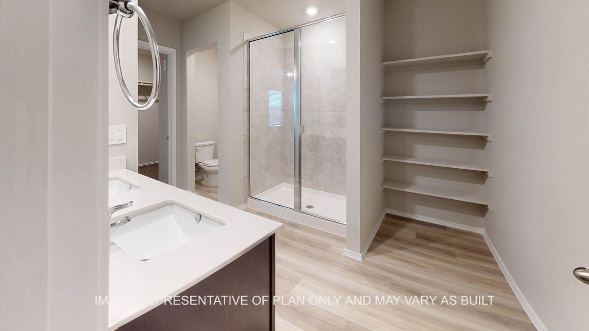 Camden primary bath with open storage shelves.