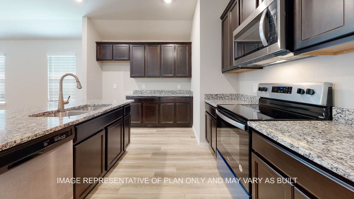 Seabrook kitchen with dark cabinets and granite countertops.