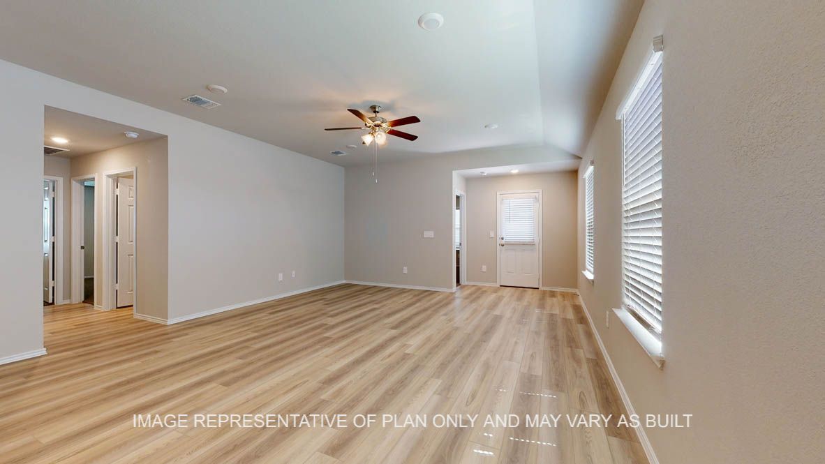 Seabrook living room with vinyl plank flooring with view into hallway to secondary bedrooms.