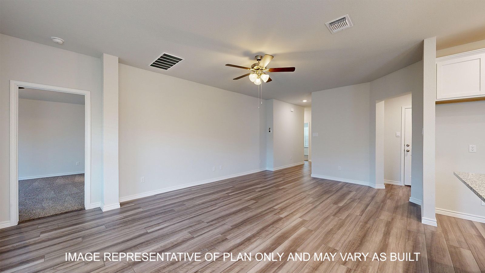 Alpine living room with vinyl plank flooring throughout.