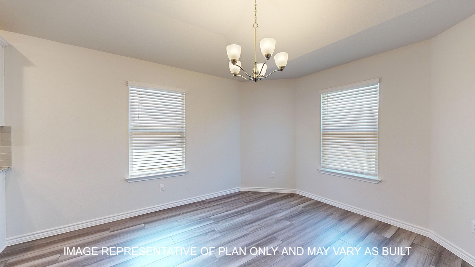 Alpine dining room with vinyl plank flooring and windows offering natural lighting.
