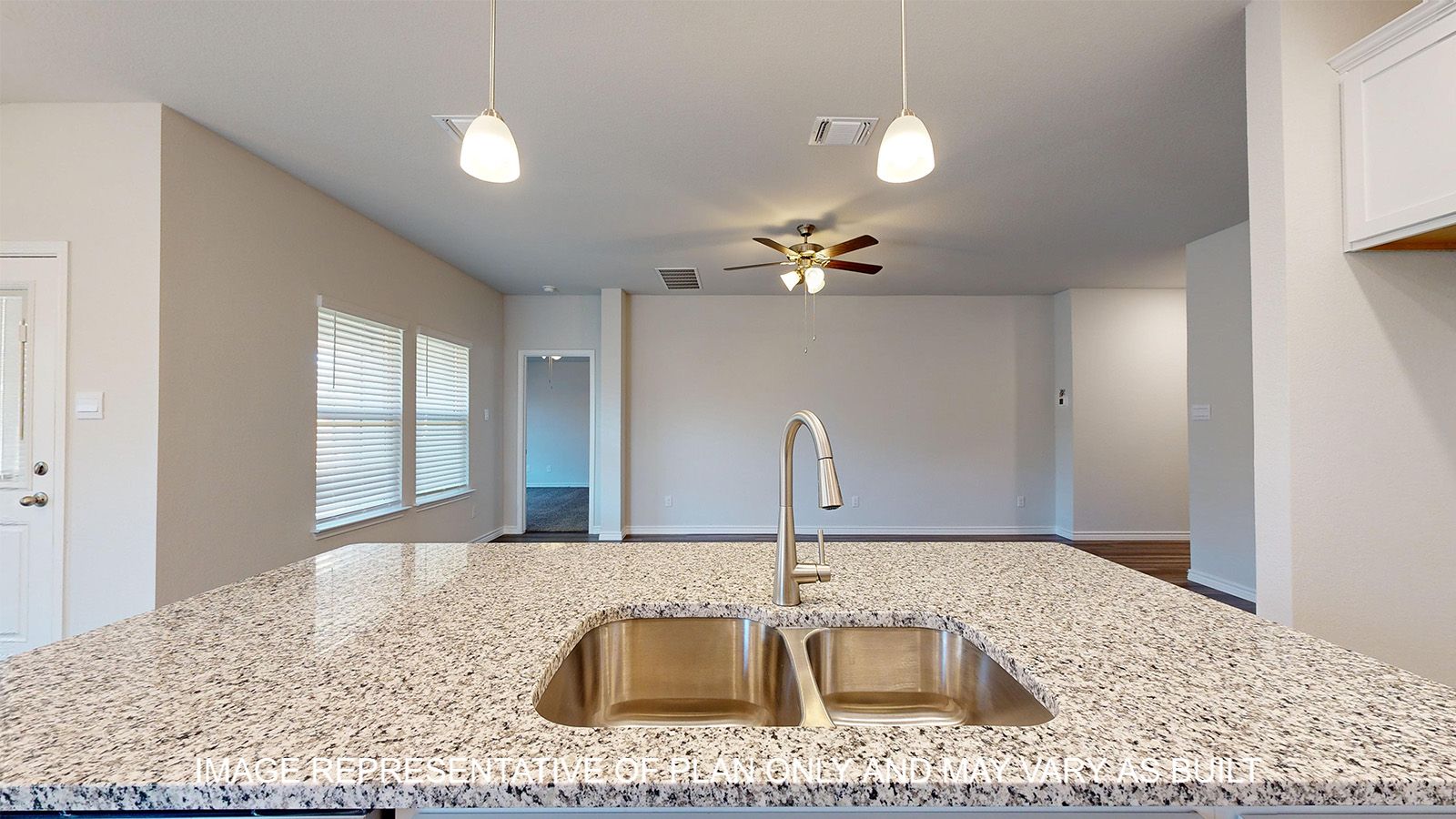 Alpine kitchen center island with granite countertops and undermount sink.