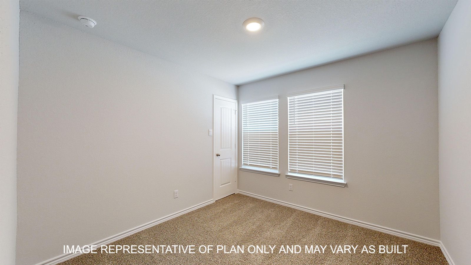 Alpine secondary bedroom with carpet flooring and window.