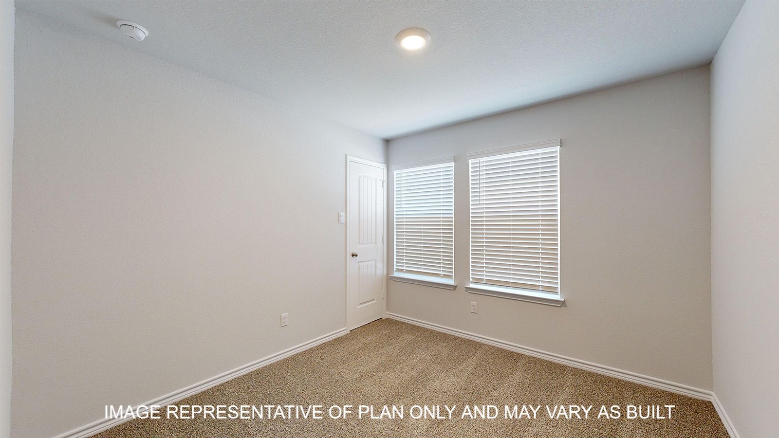 Alpine secondary bedroom with carpet flooring and window.