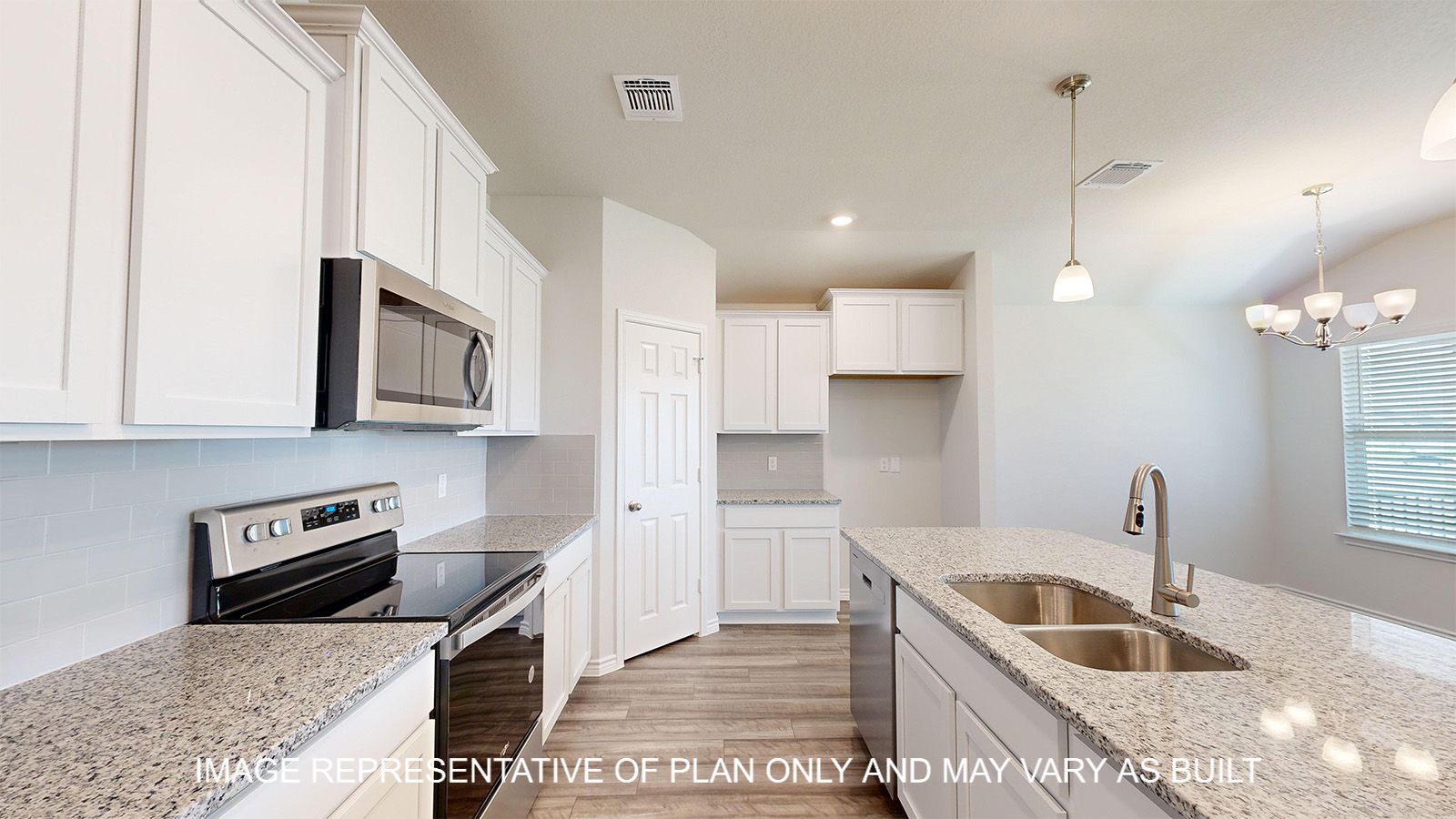 Dakota kitchen with white cabinets and granite countertops.