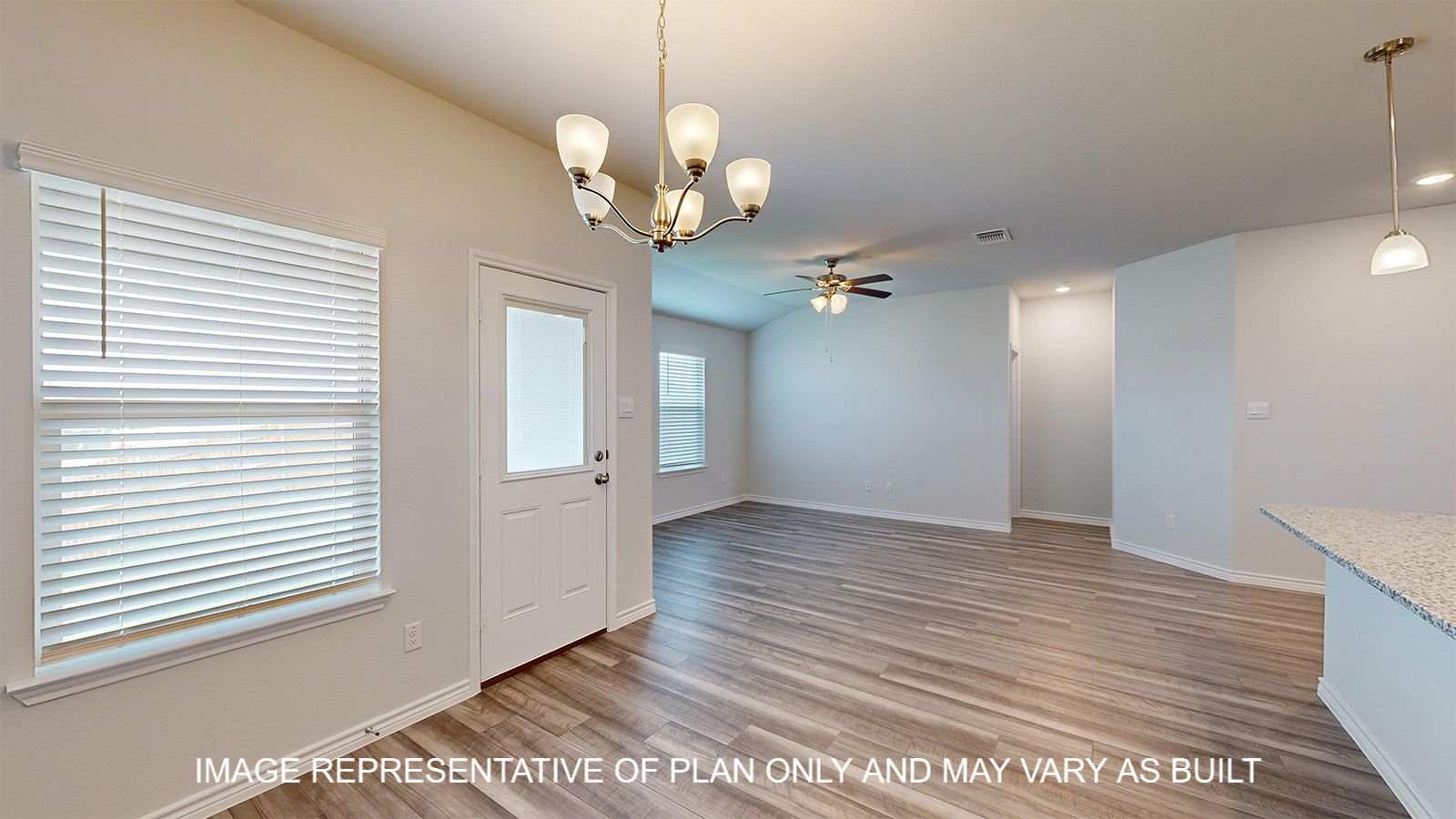 Dakota dining room with view into living room and windows with natural lighting.