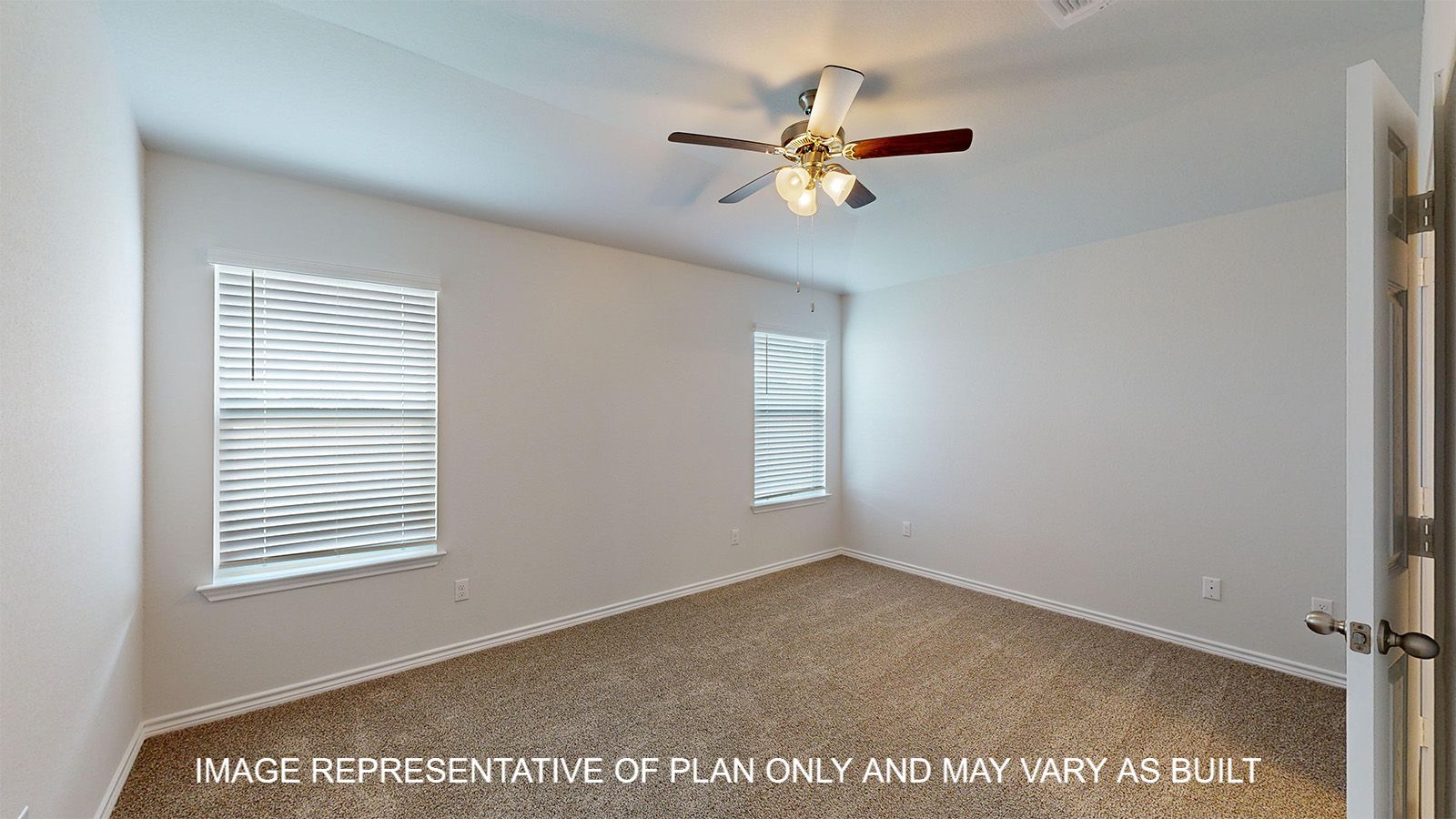 Dakota primary bedroom with carpet floors and windows.