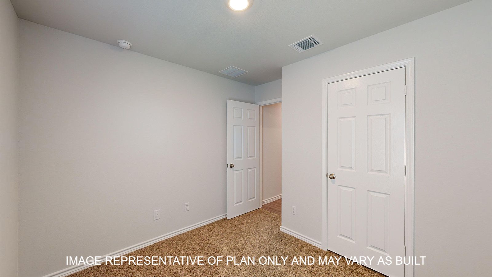 Dakota secondary bedroom with carpet flooring.