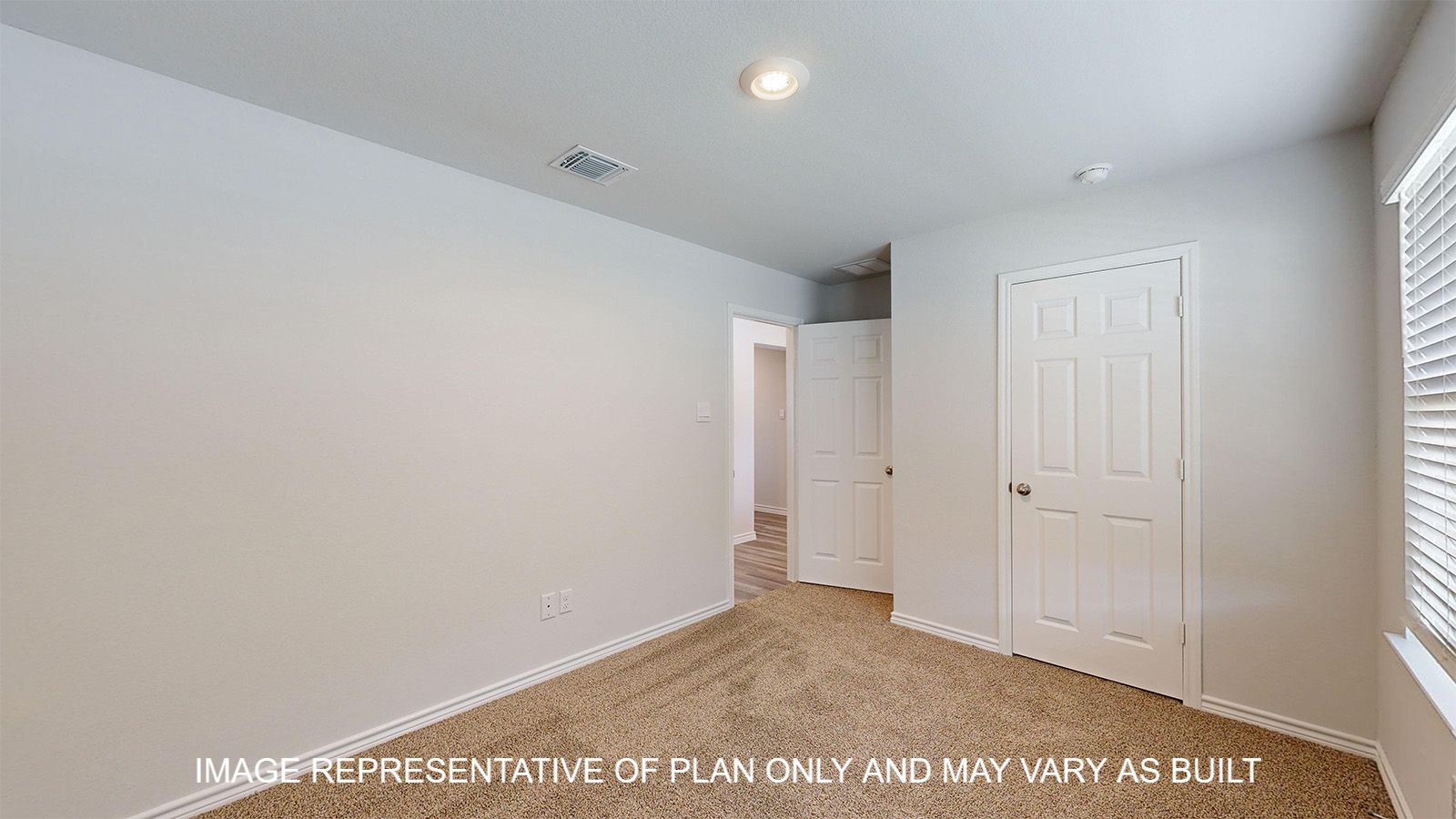 Dakota secondary bedroom with carpet flooring.