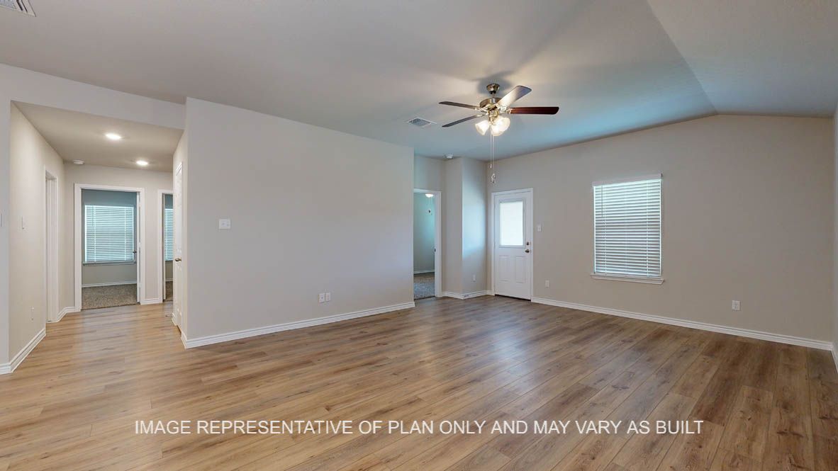 Richmond living room with view into hallway with secondary bedrooms and vinyl plank throughout.