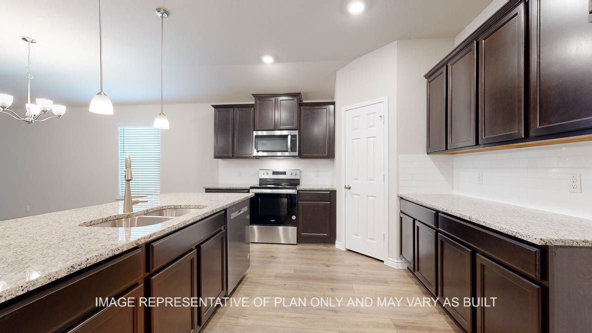 Richmond kitchen with dark cabinets and granite countertops.