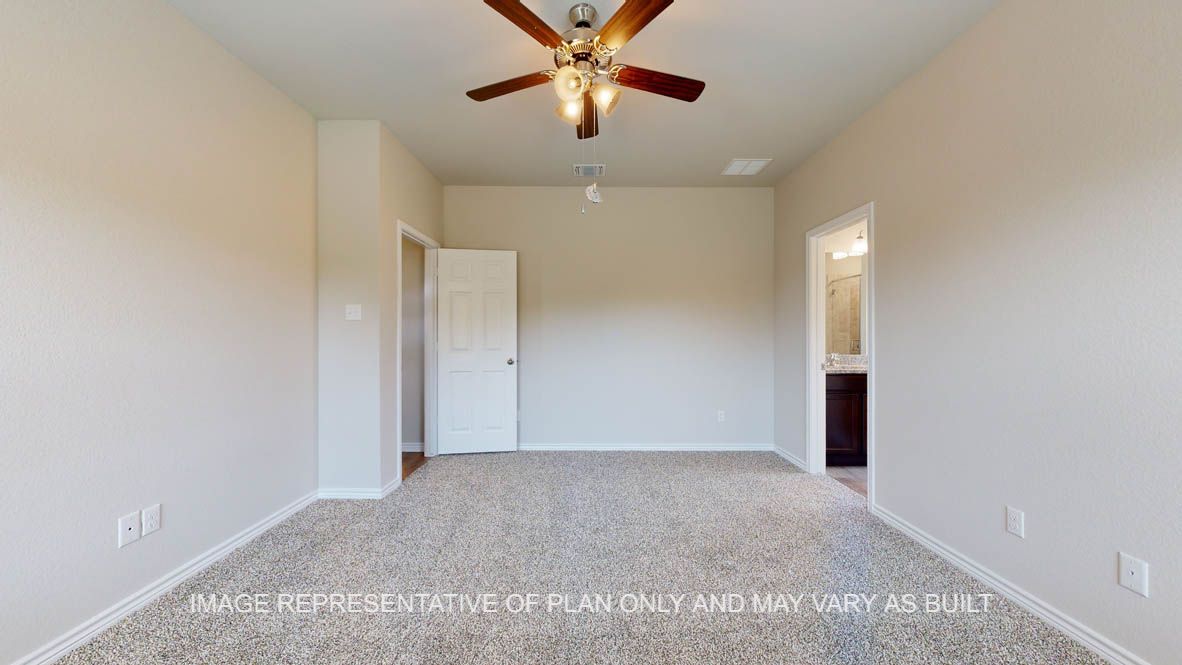 Richmond primary bedroom with carpet flooring and ceiling fan.