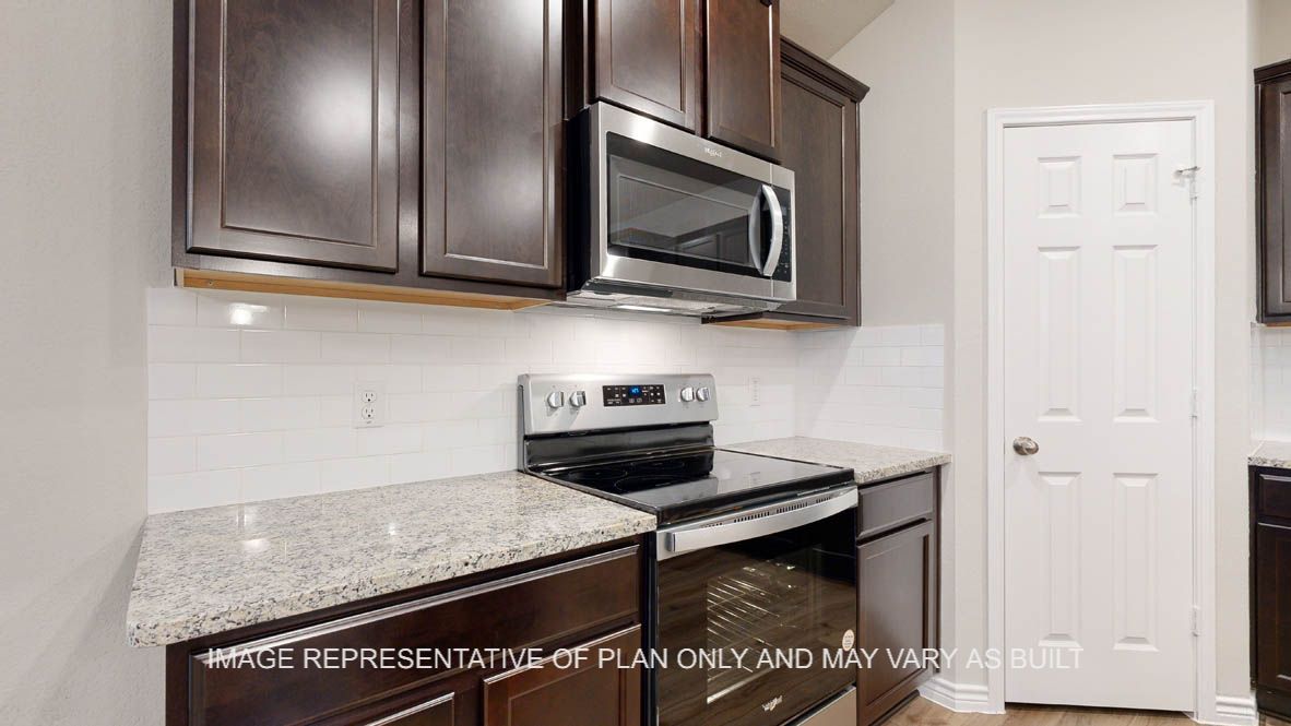 Richmond kitchen with dark cabinets and stainless appliances.