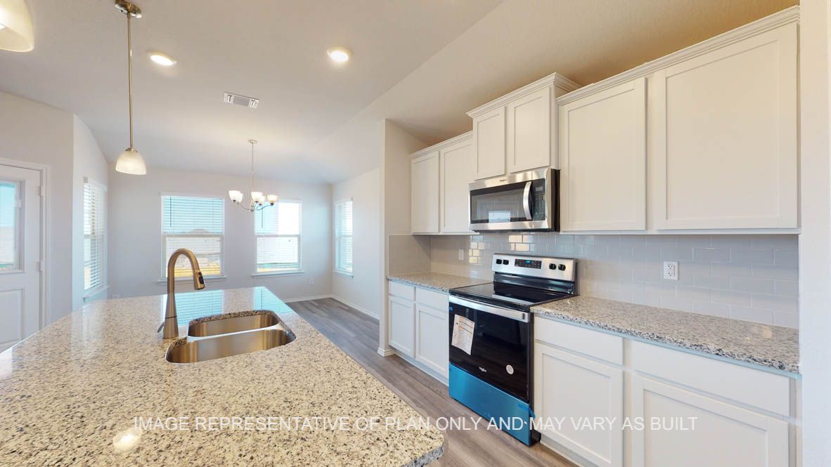 Prescott kitchen with white cabinets and granite countertops.