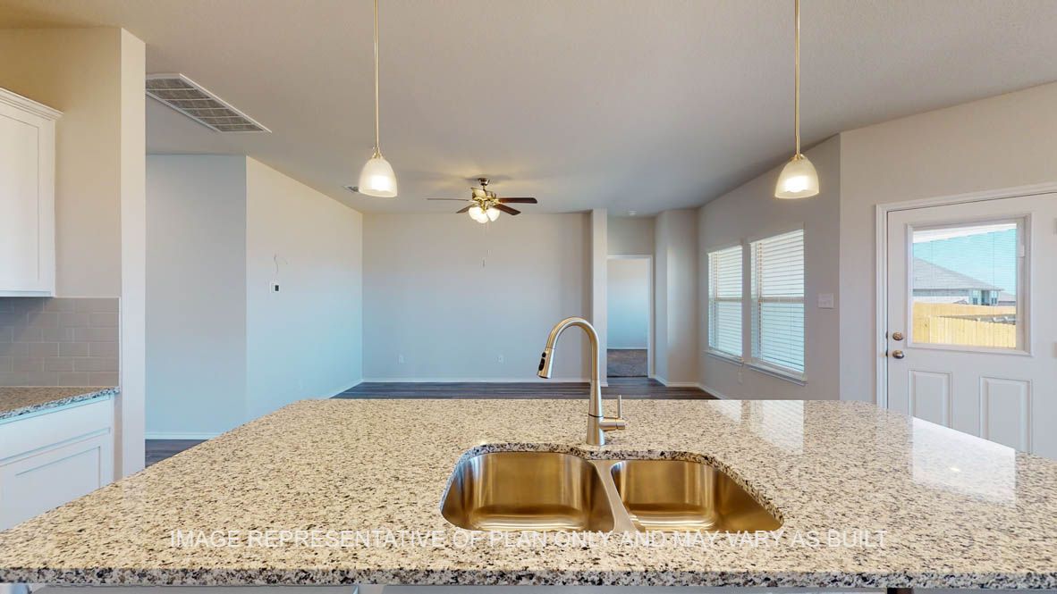 Prescott kitchen center island with granite countertops and undermount sink.