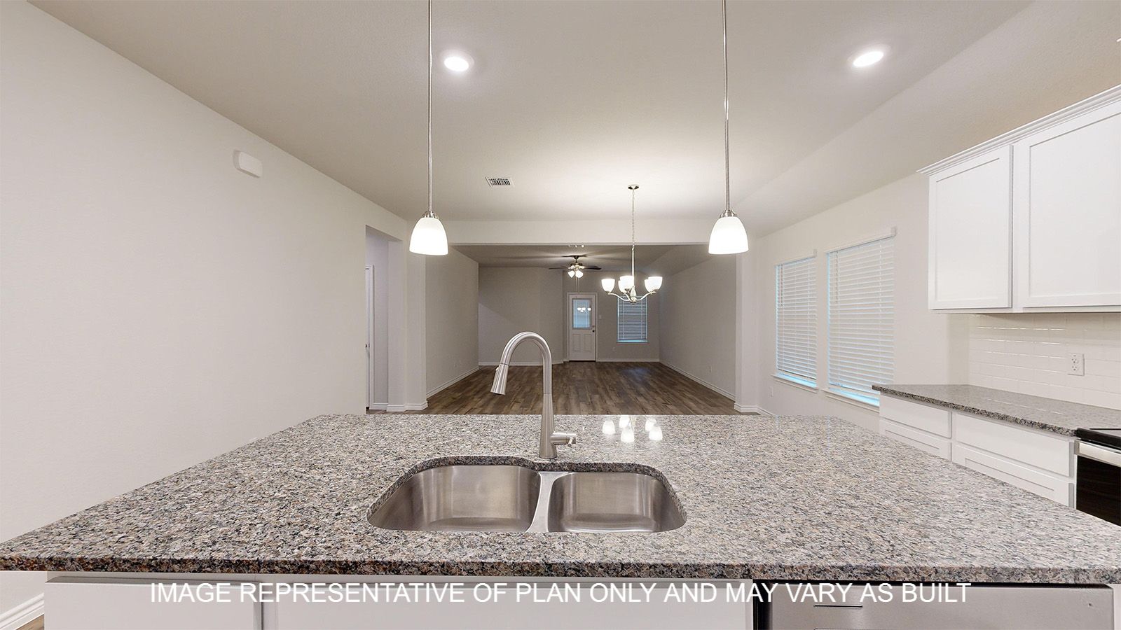 Everett kitchen with vinyl plank flooring and pendant light fixtures over kitchen island.